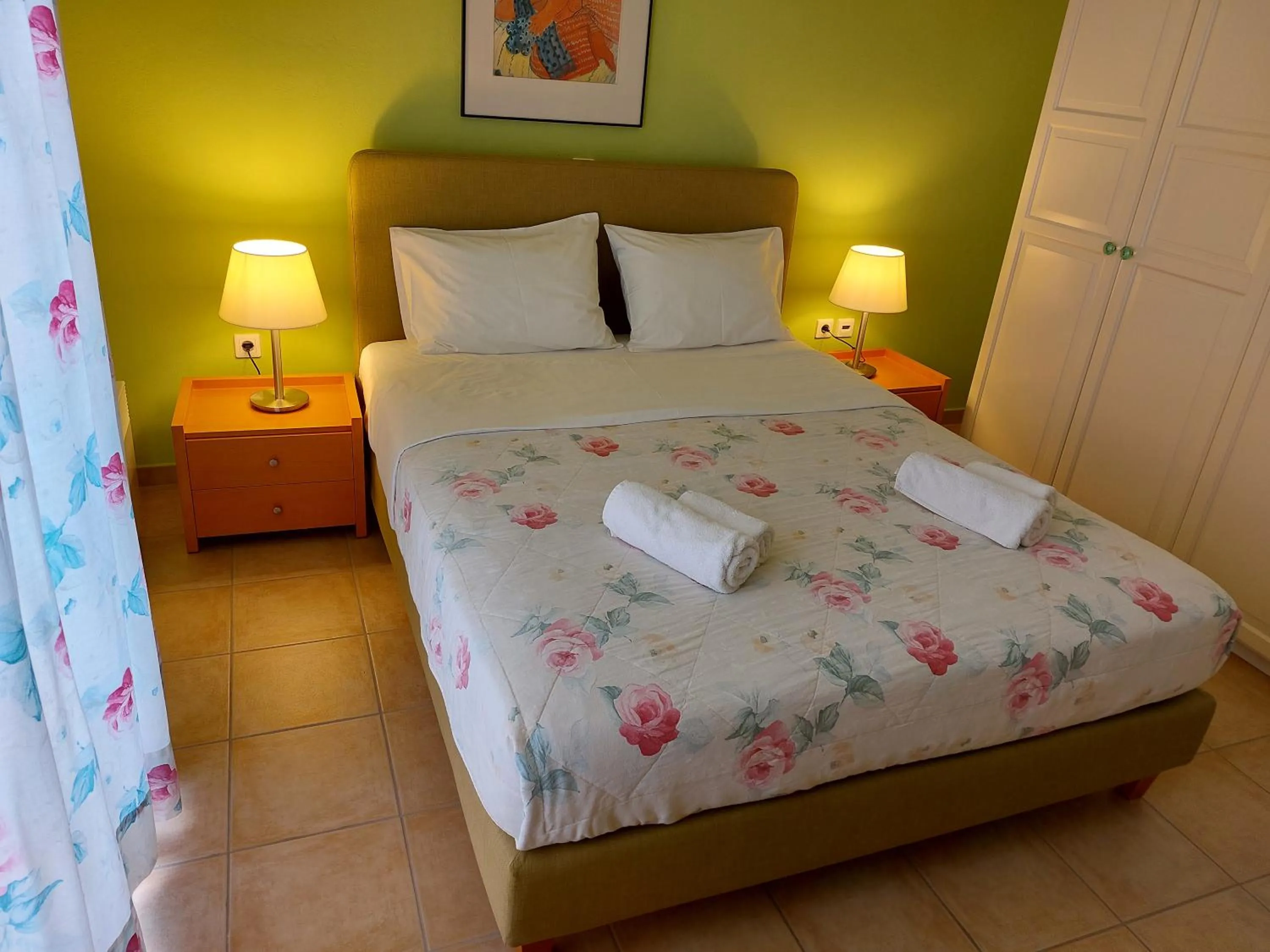 Bed in PLEIADES lUXURY APARTMENTS