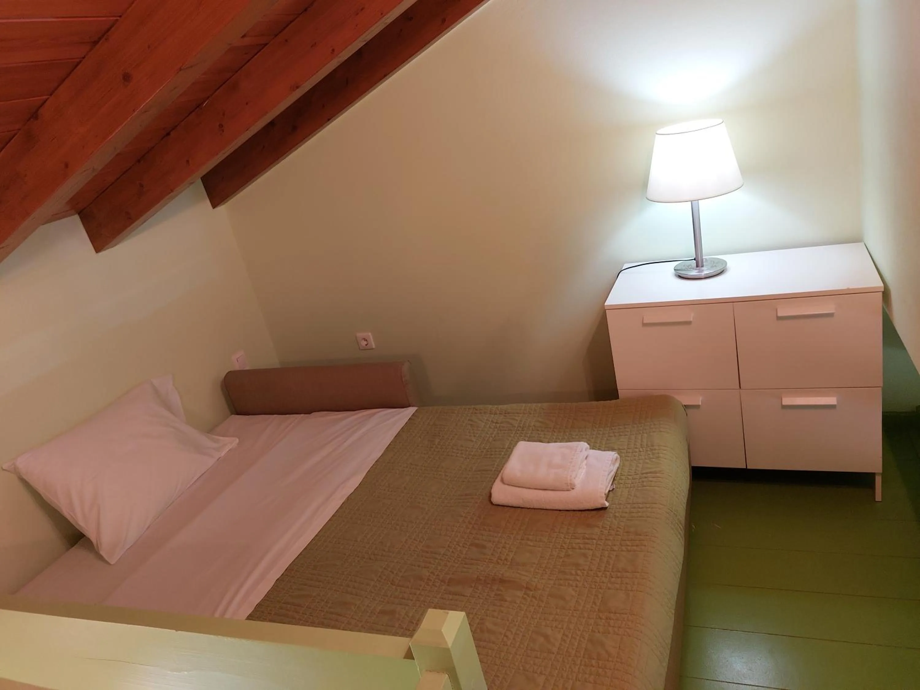 Bed in PLEIADES lUXURY APARTMENTS