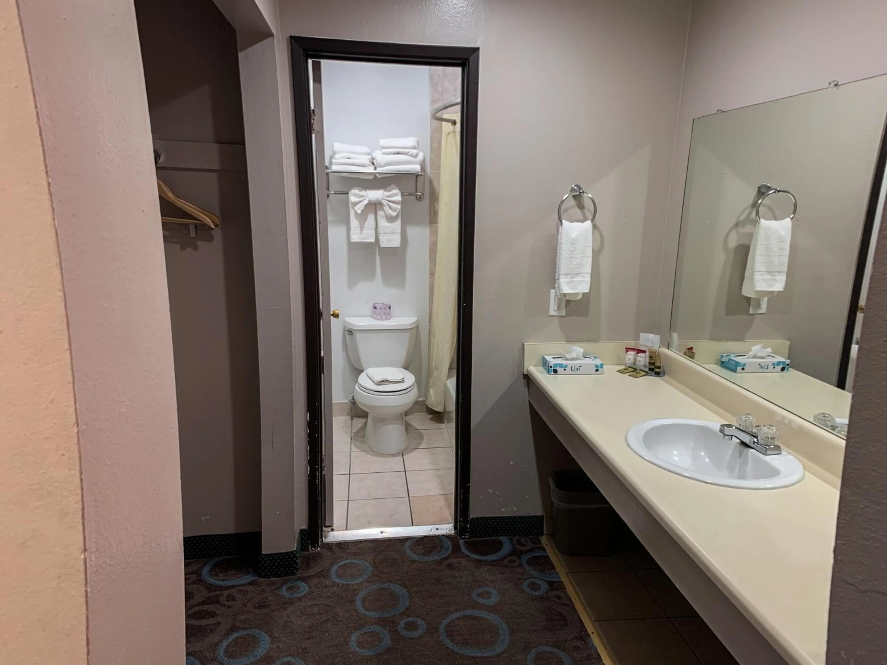 Toilet in Ventura Grand Inn