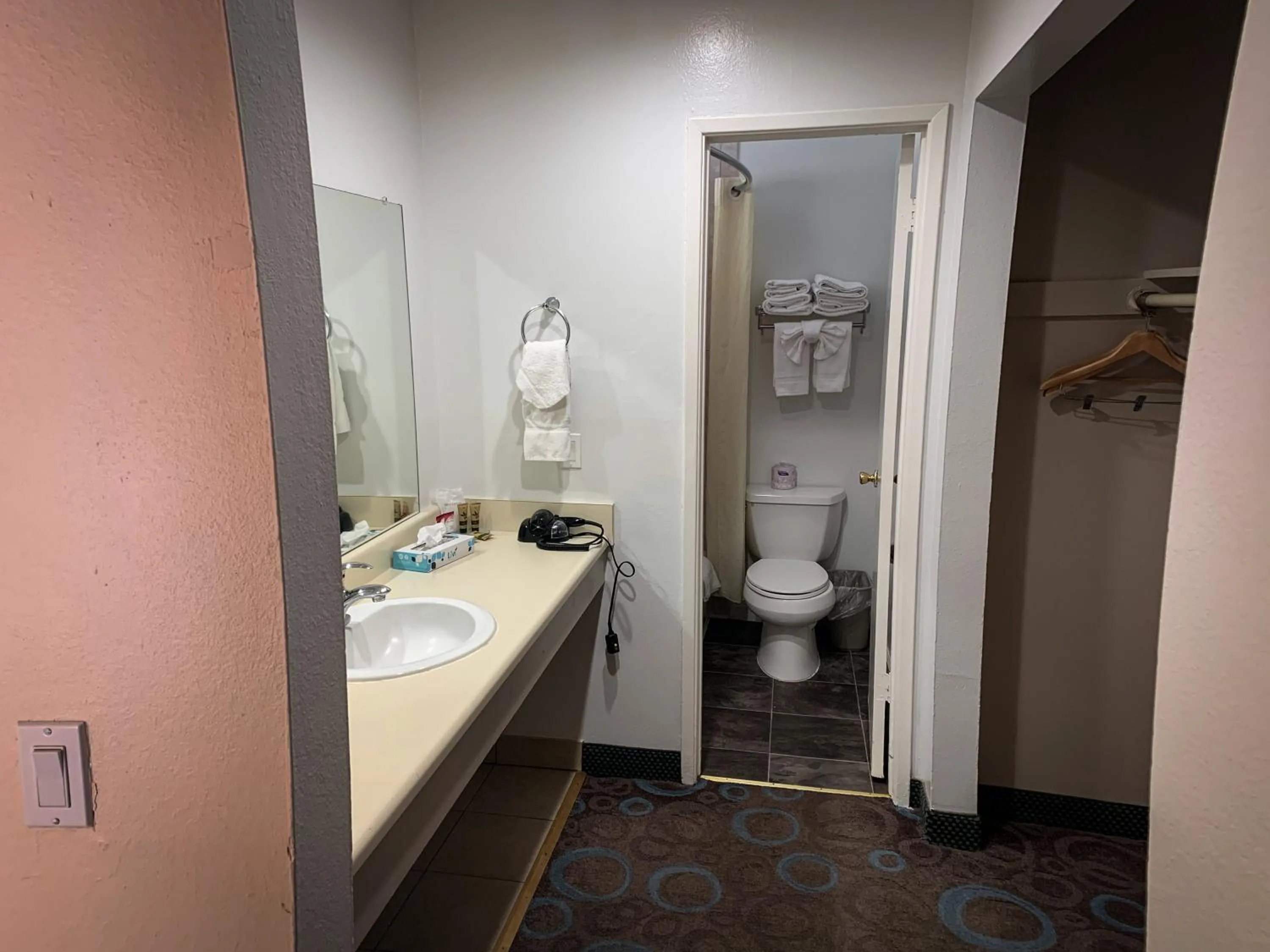 Toilet in Ventura Grand Inn