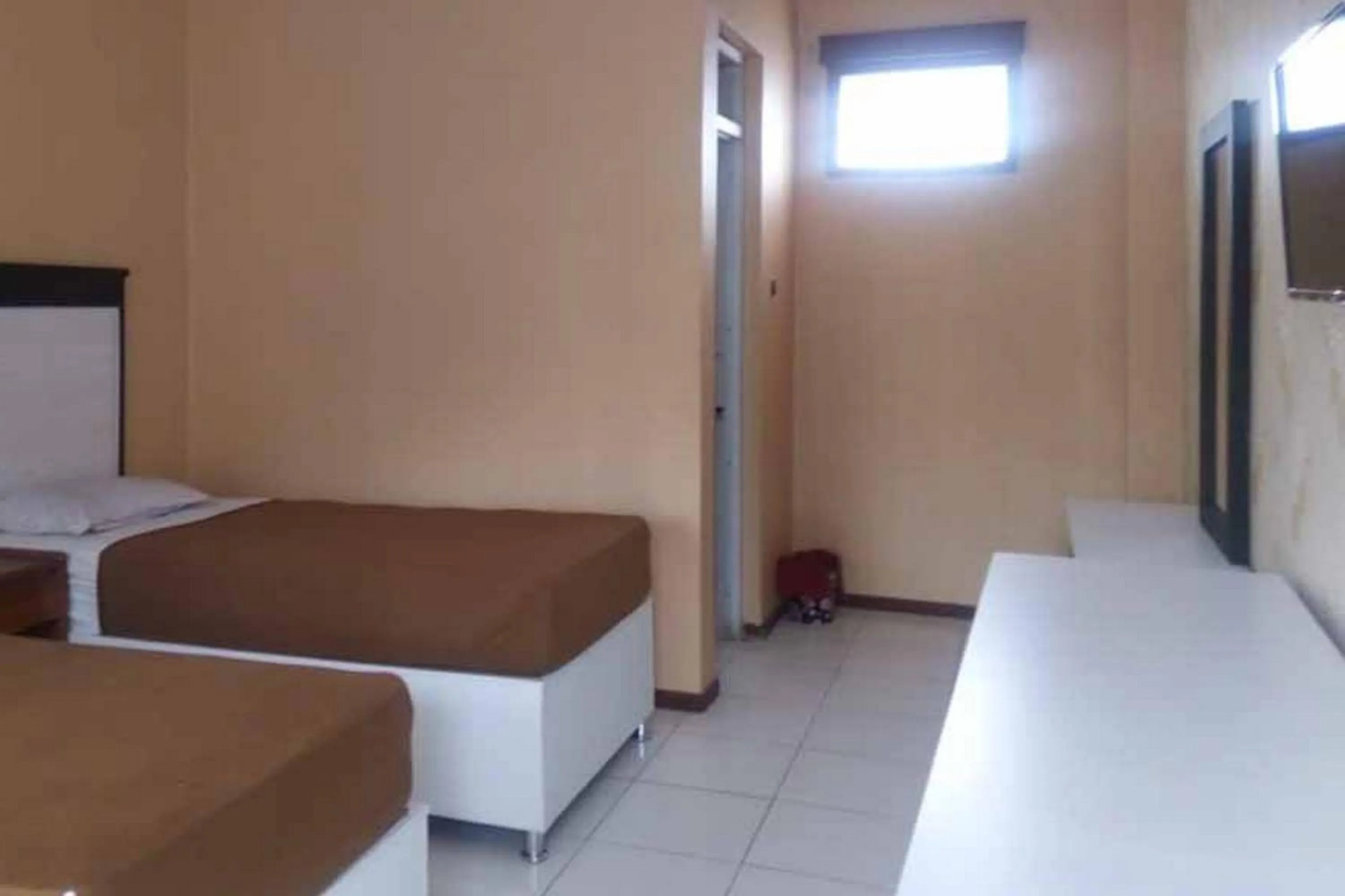 Bed in RedDoorz Syariah @ Hotel Kencana Tasikmalaya