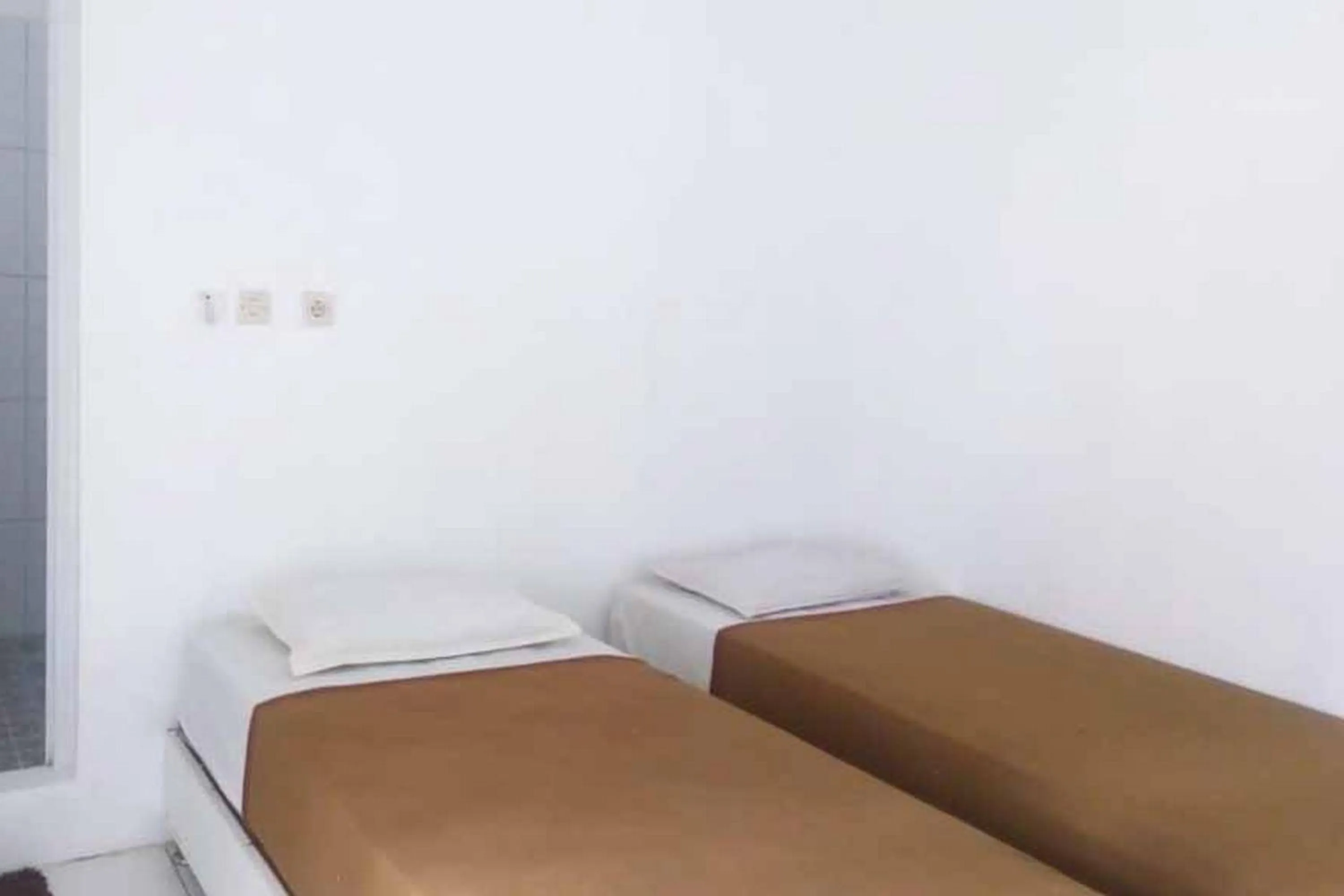 Bed in RedDoorz Syariah @ Hotel Kencana Tasikmalaya