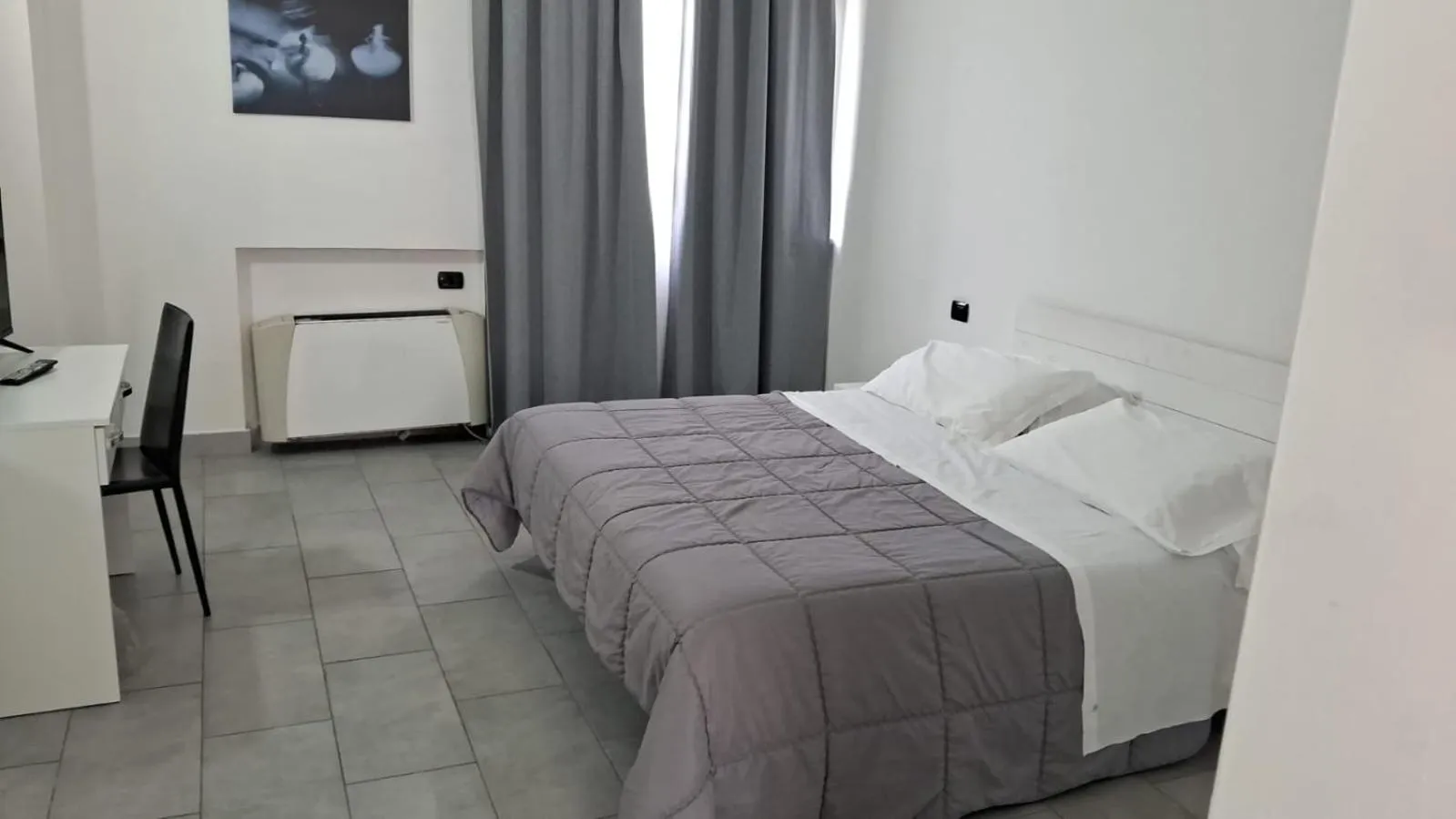 Bed in HOTEL QUADRIFOGLIO