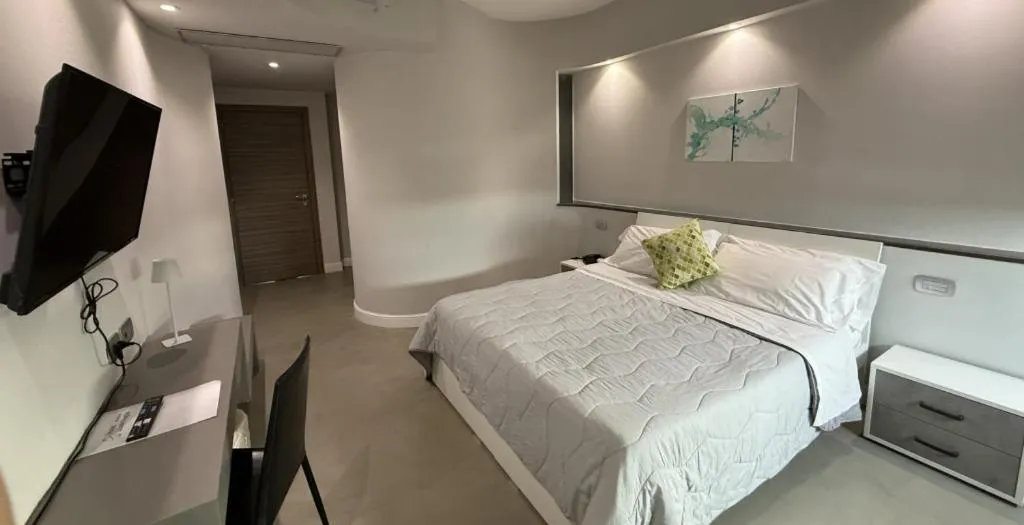 Bed in HOTEL QUADRIFOGLIO