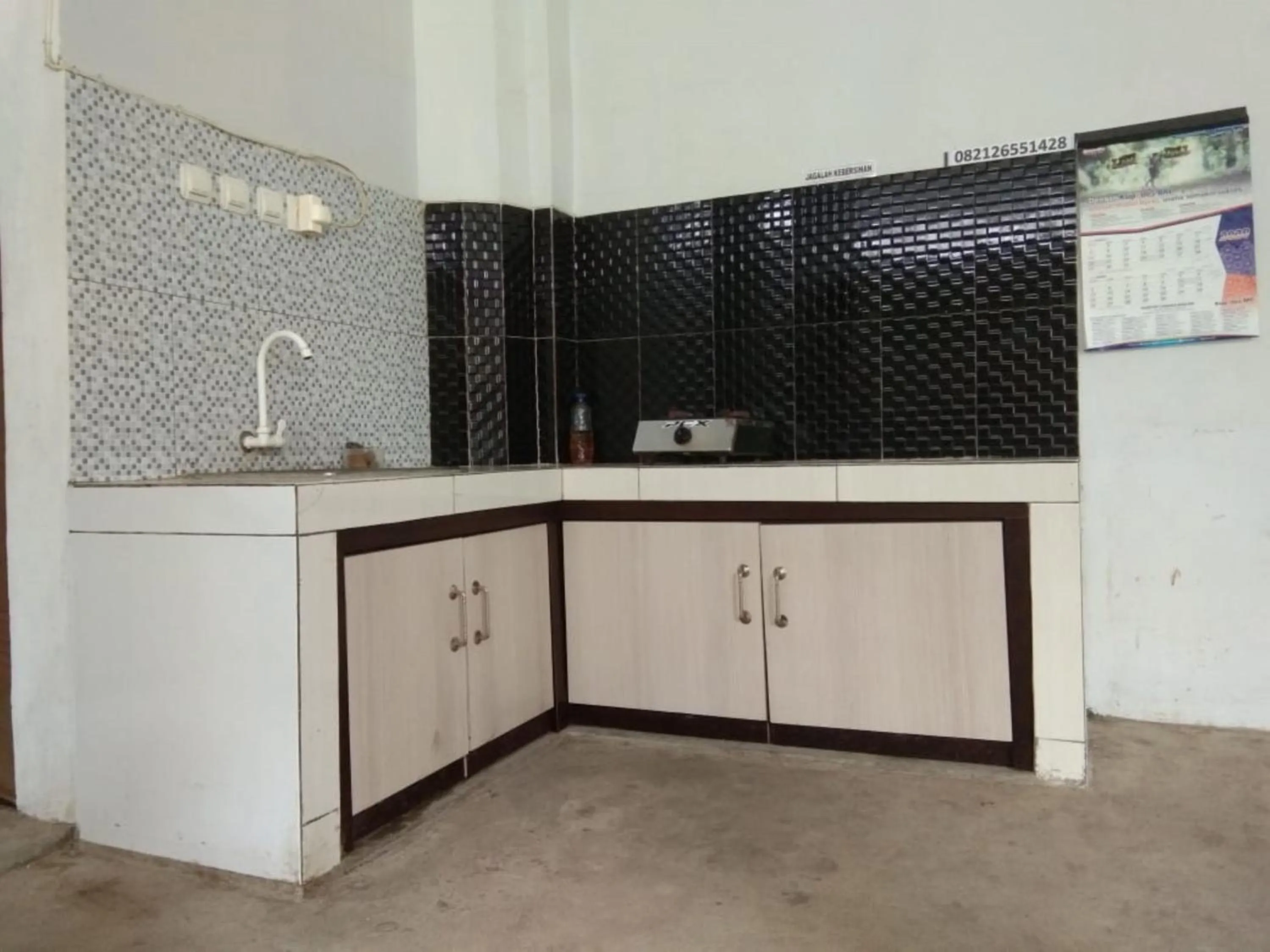 Kitchen or kitchenette in Hotel Abad Baru 1