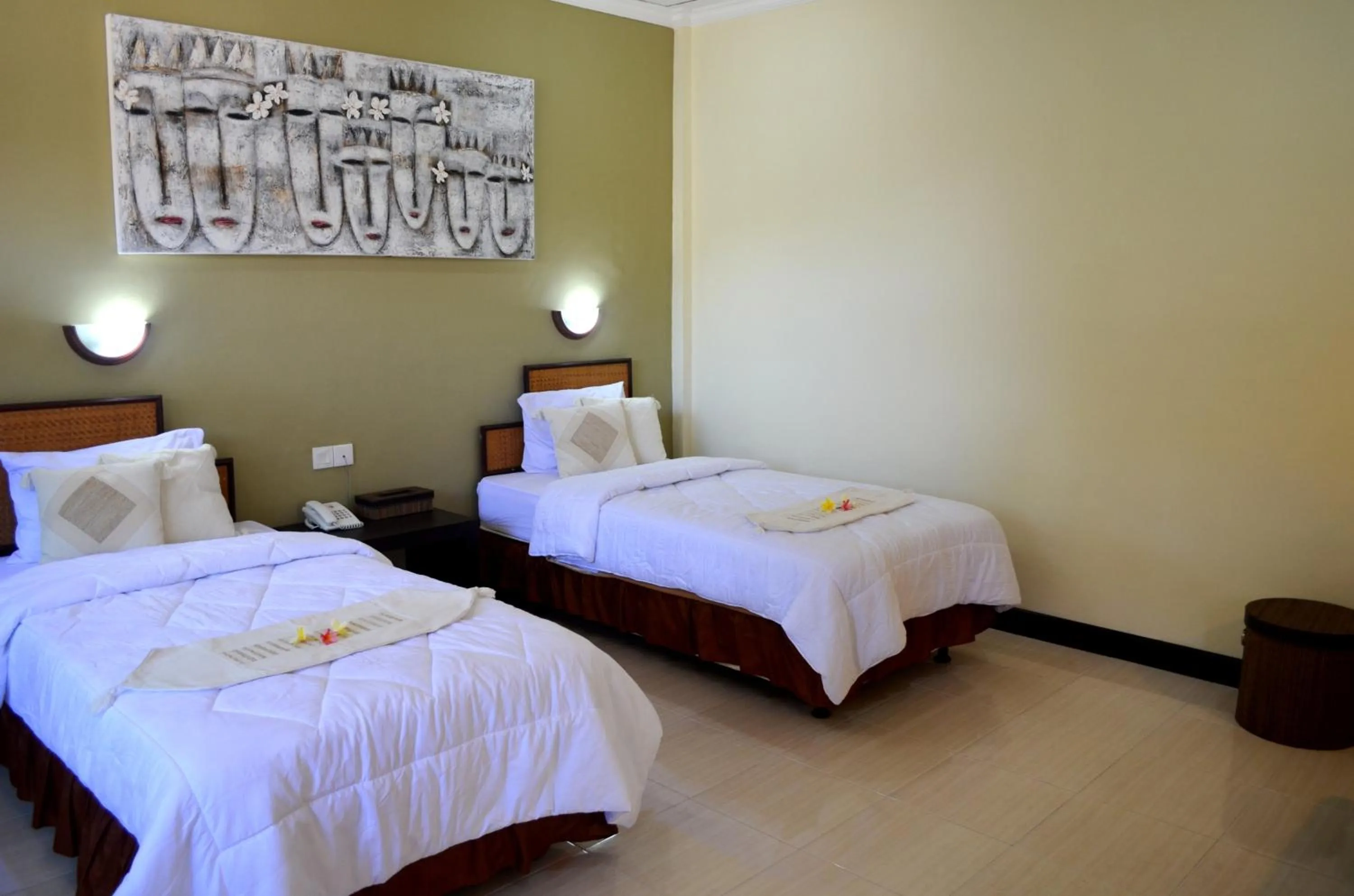 Bed in Troppo Zone Puri Rama Resort Kuta