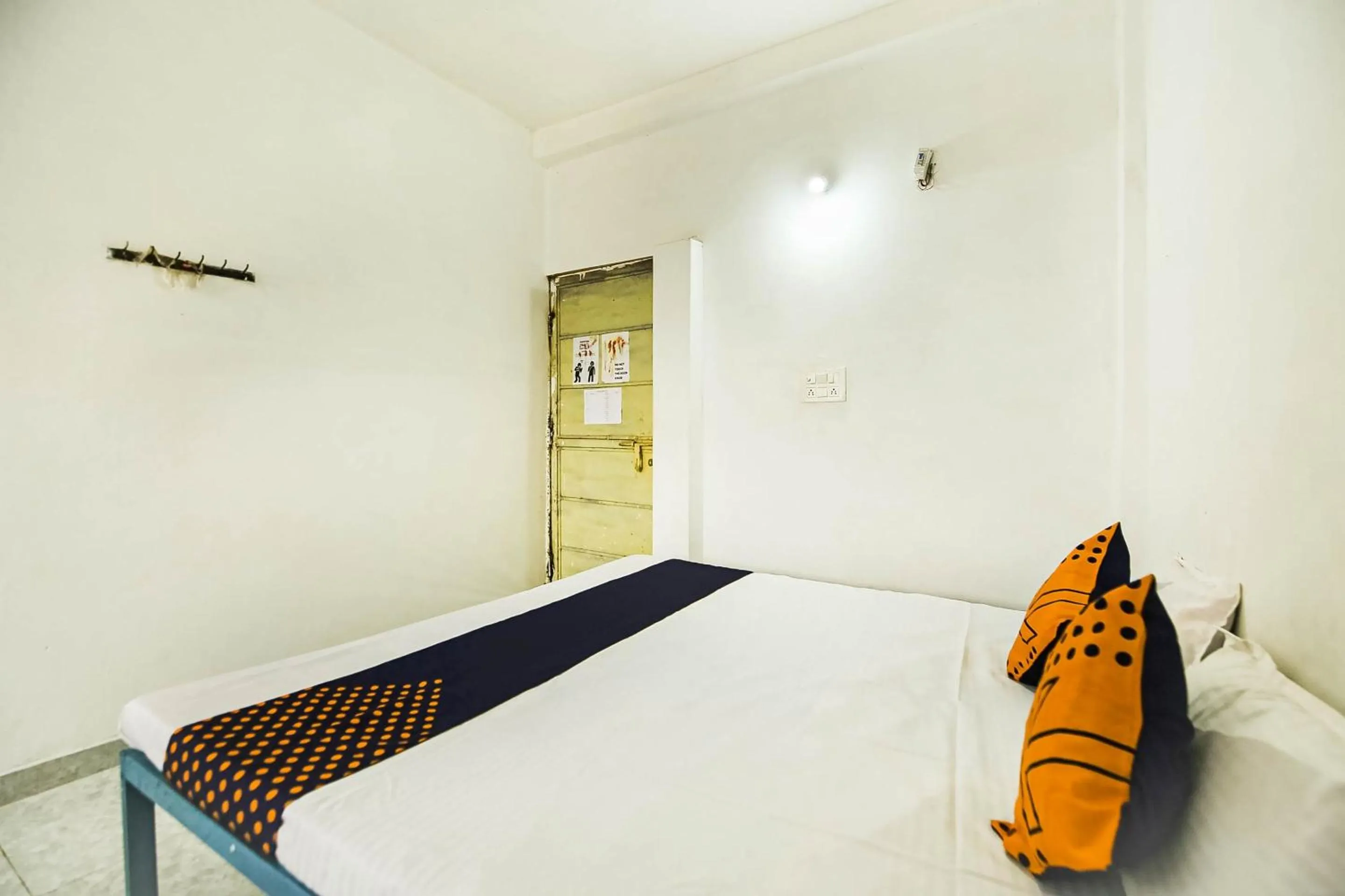 Bedroom, Bed in SPOT ON by OYO Krishna Market And Lodge