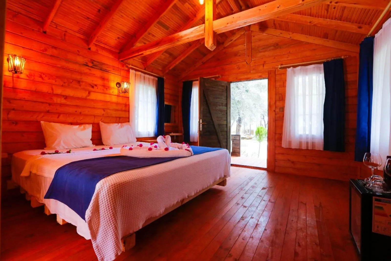 Bed in Green Pine Bungalows & Beach Luxury Concept