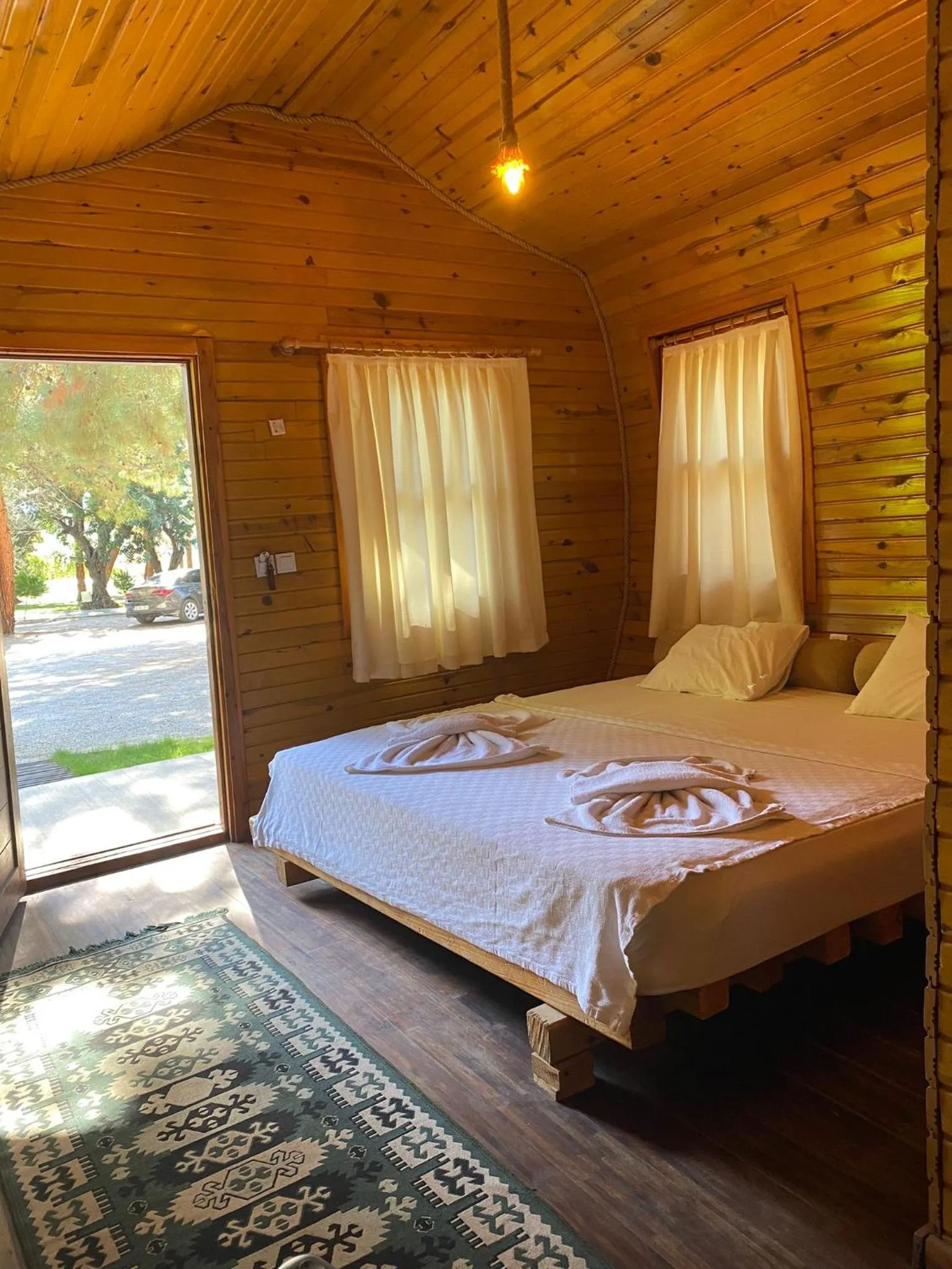 Bed in Green Pine Bungalows & Beach Luxury Concept