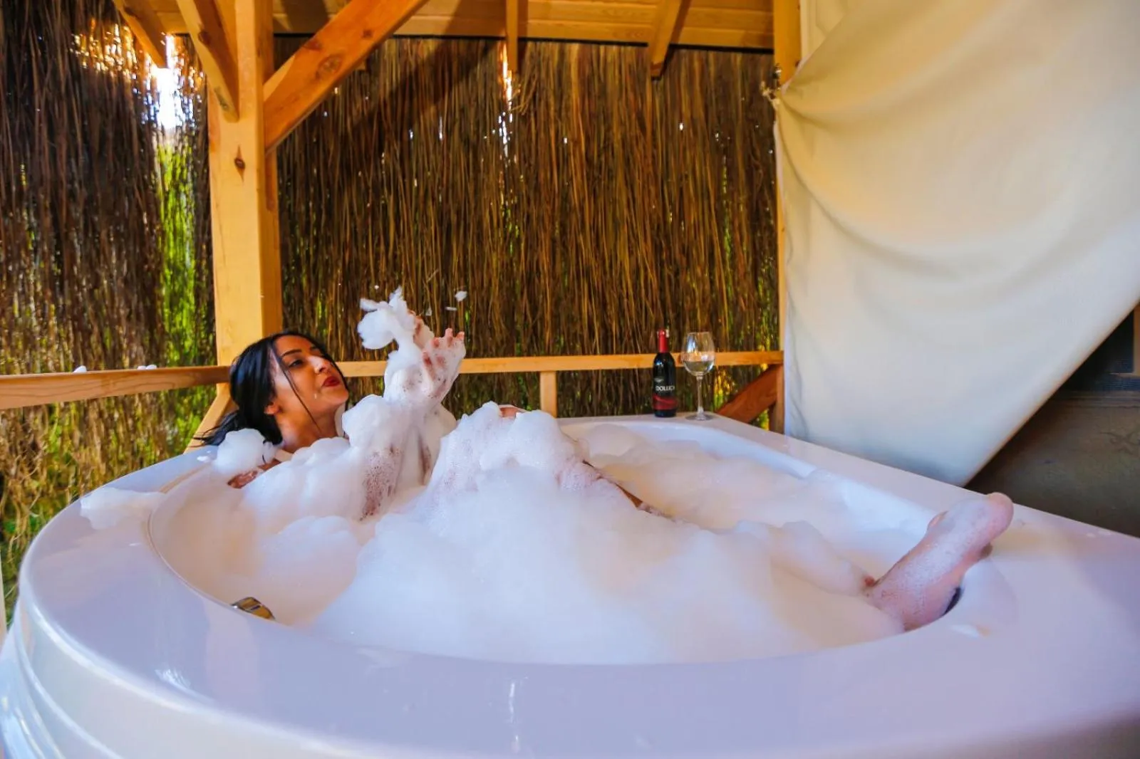 People in Green Pine Bungalows & Beach Luxury Concept