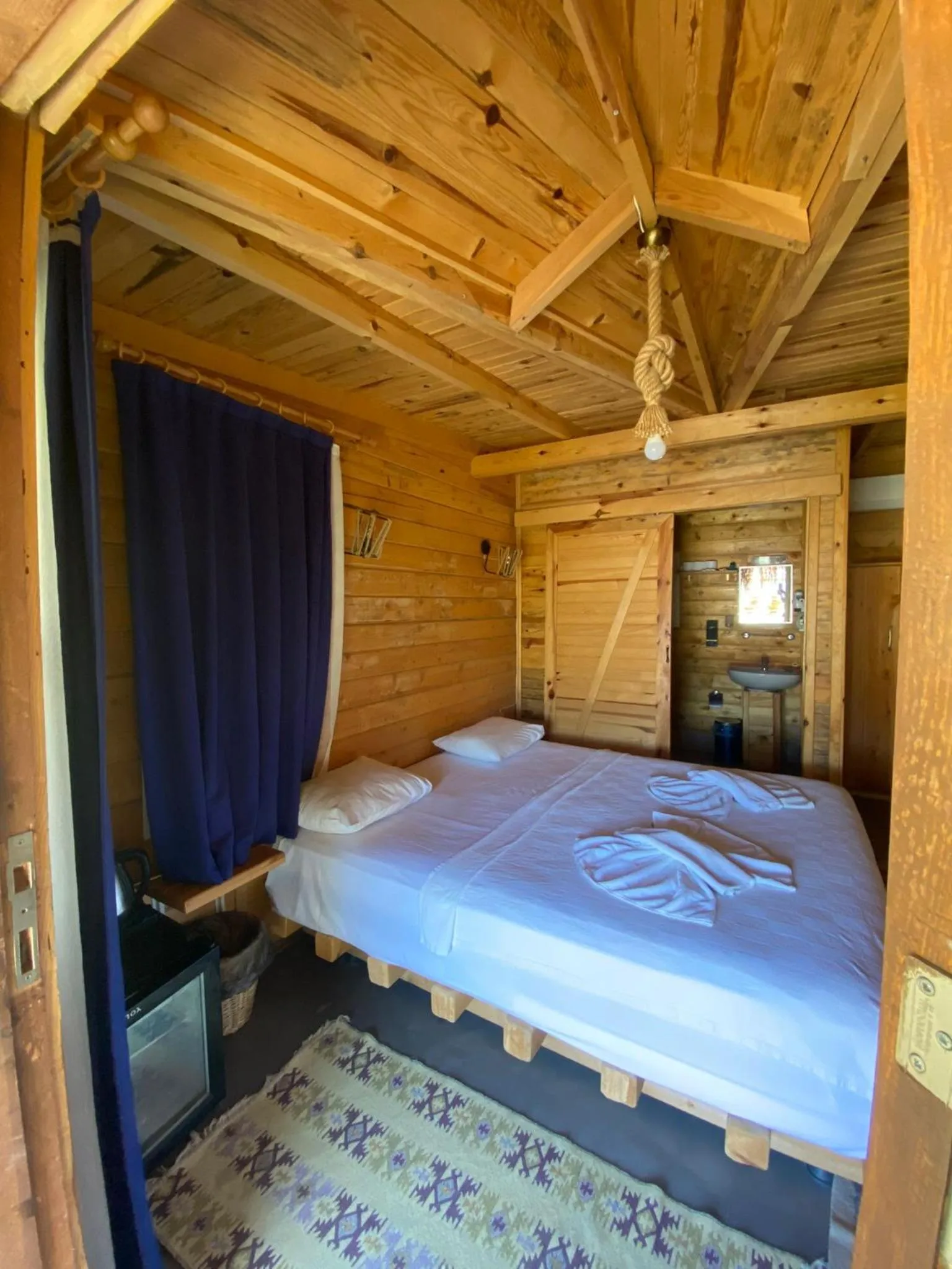 Bed in Green Pine Bungalows & Beach Luxury Concept
