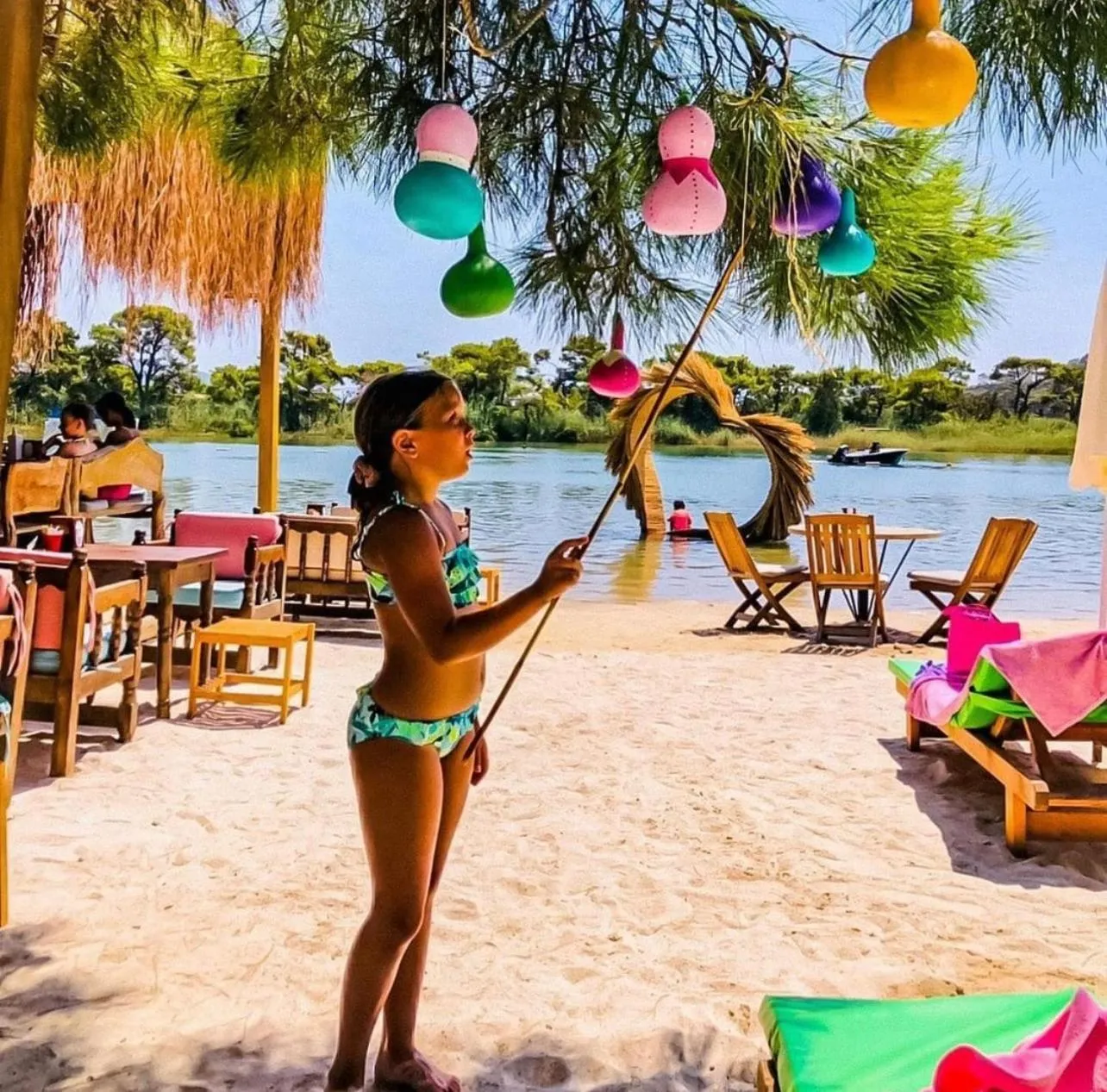 People in Green Pine Bungalows & Beach Luxury Concept