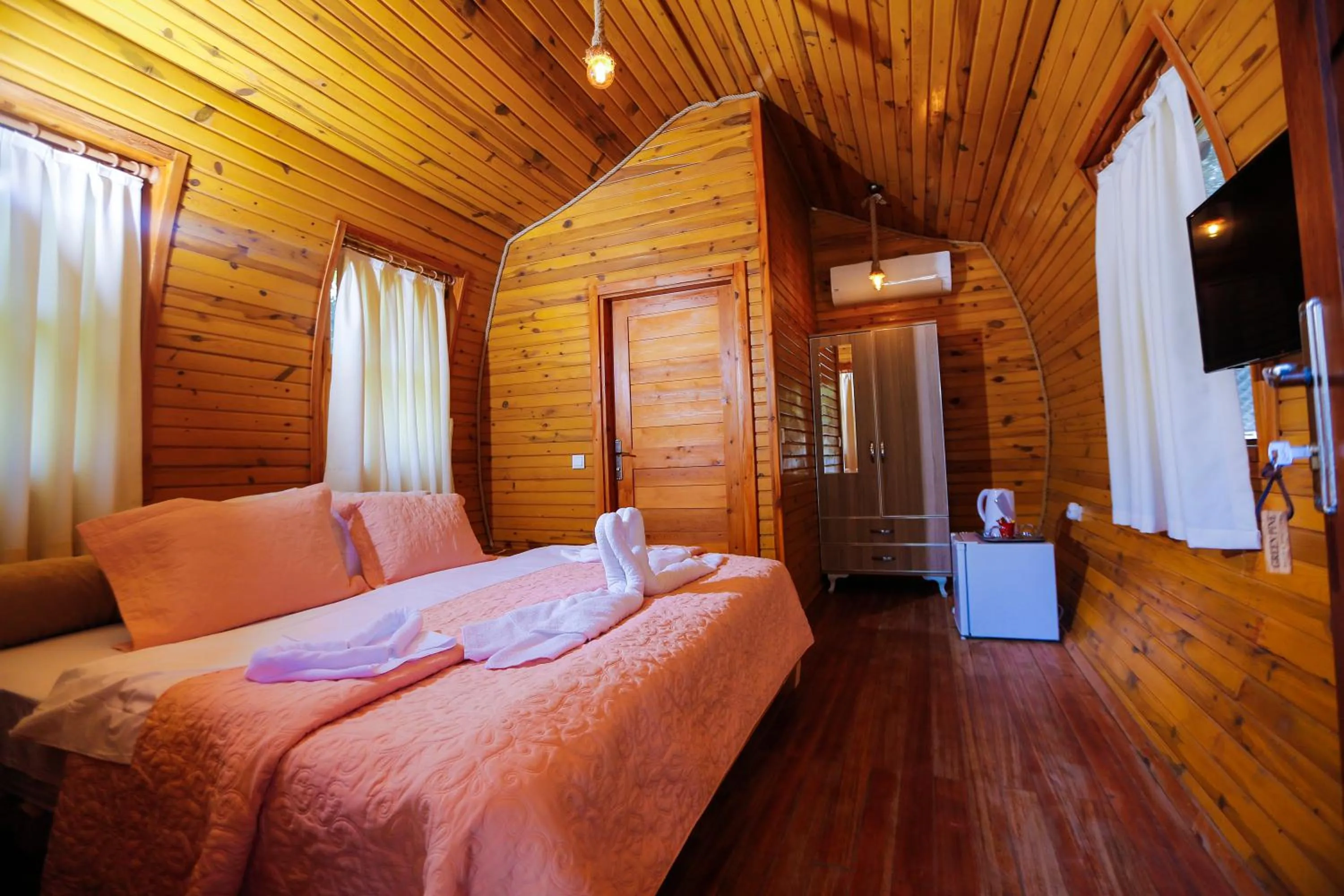 Bed in Green Pine Bungalows & Beach Luxury Concept