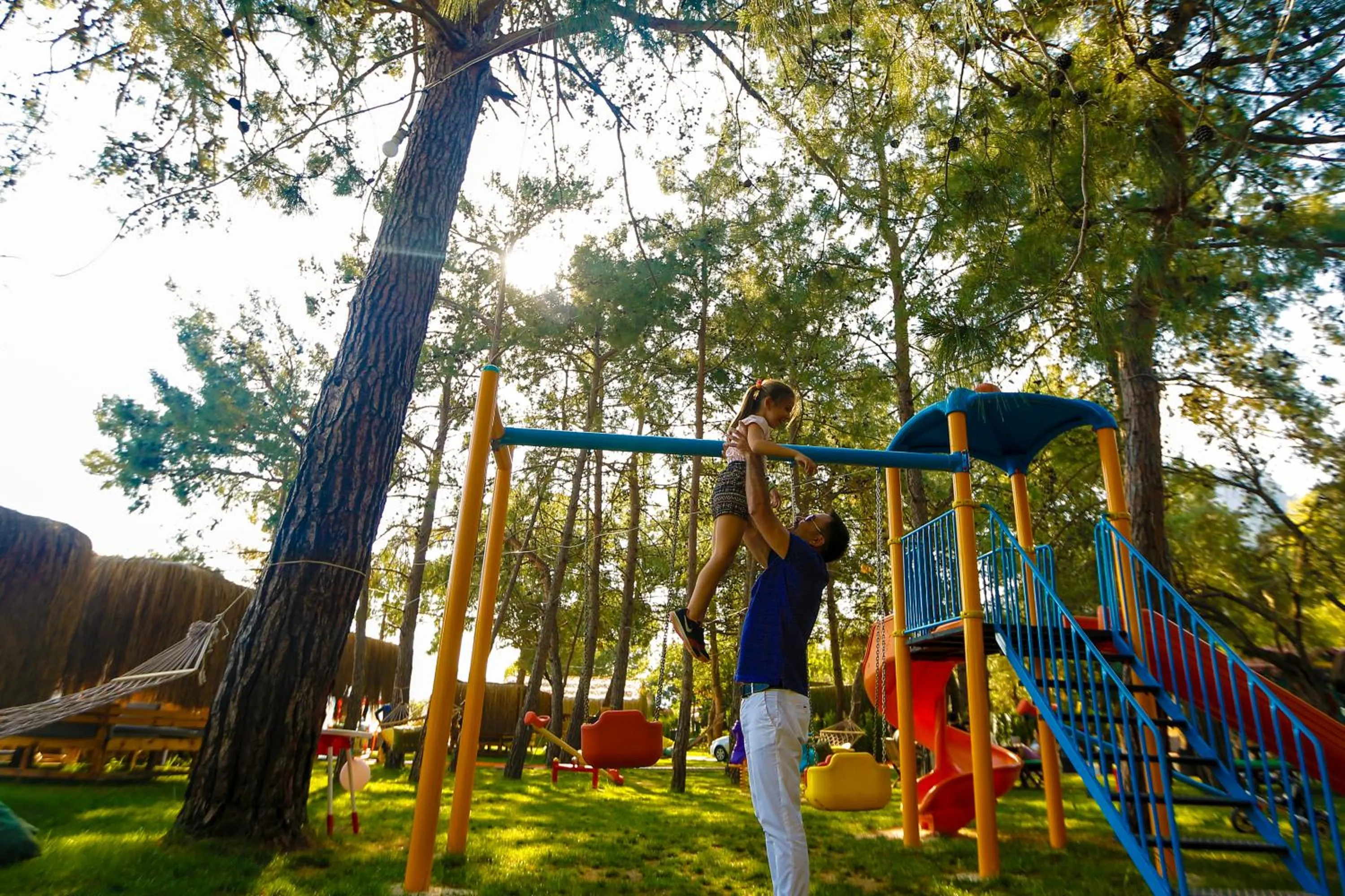 People in Green Pine Bungalows & Beach Luxury Concept