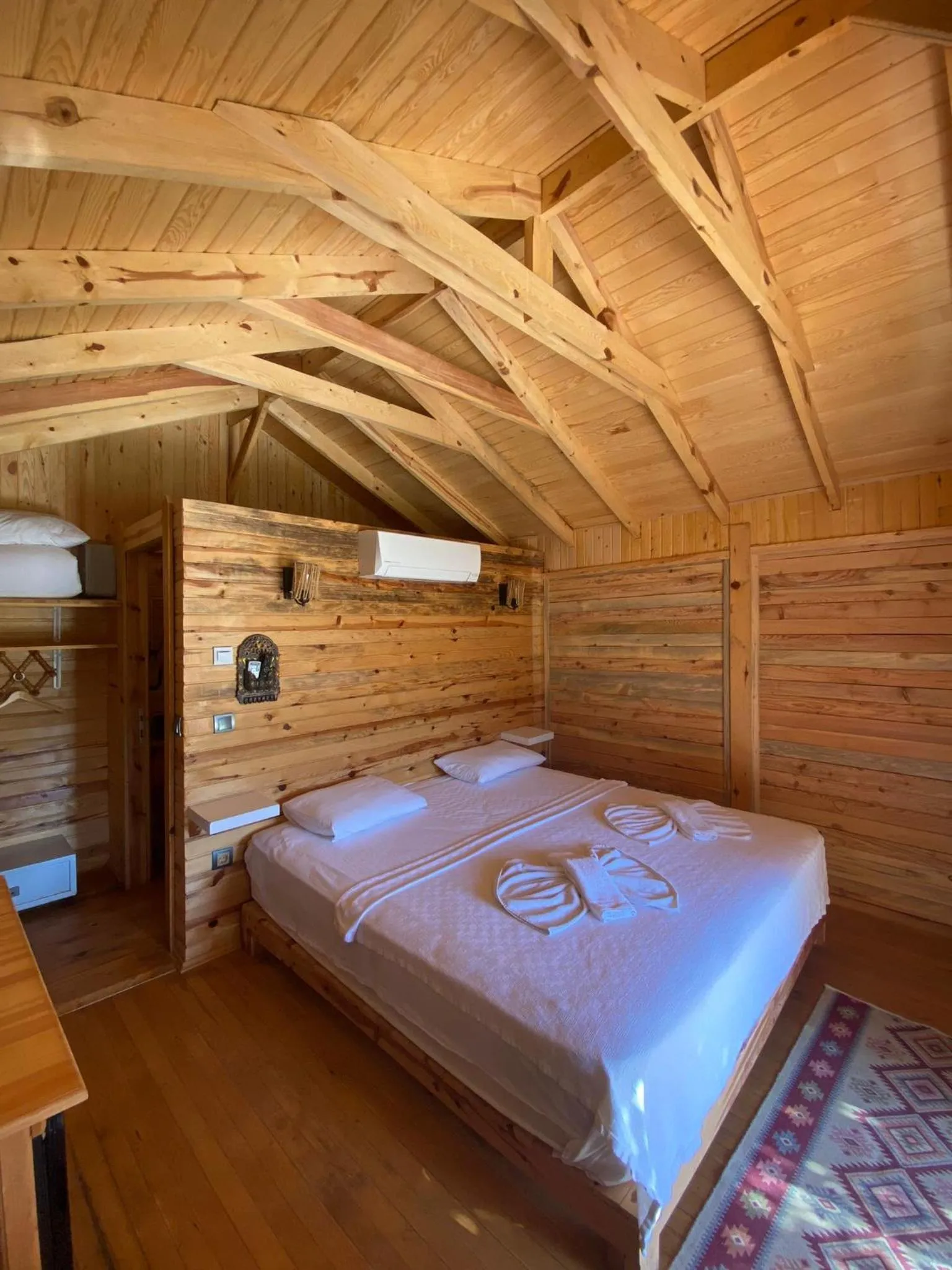 Bed in Green Pine Bungalows & Beach Luxury Concept