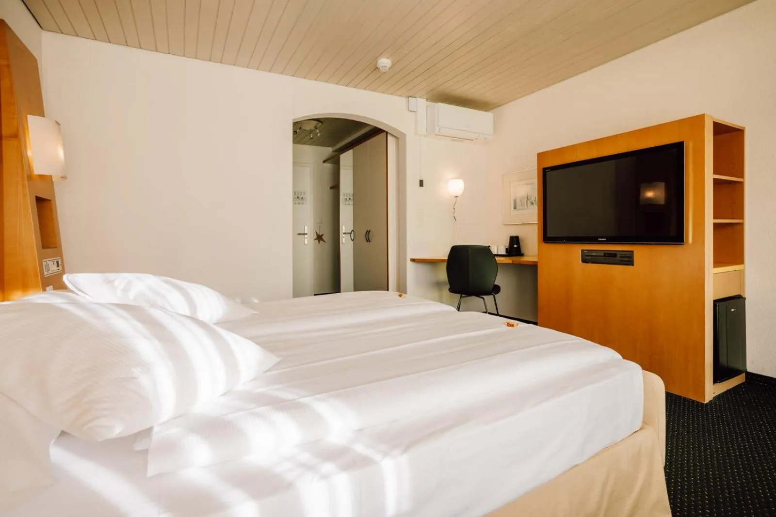 Bed in Stella Swiss Quality Hotel