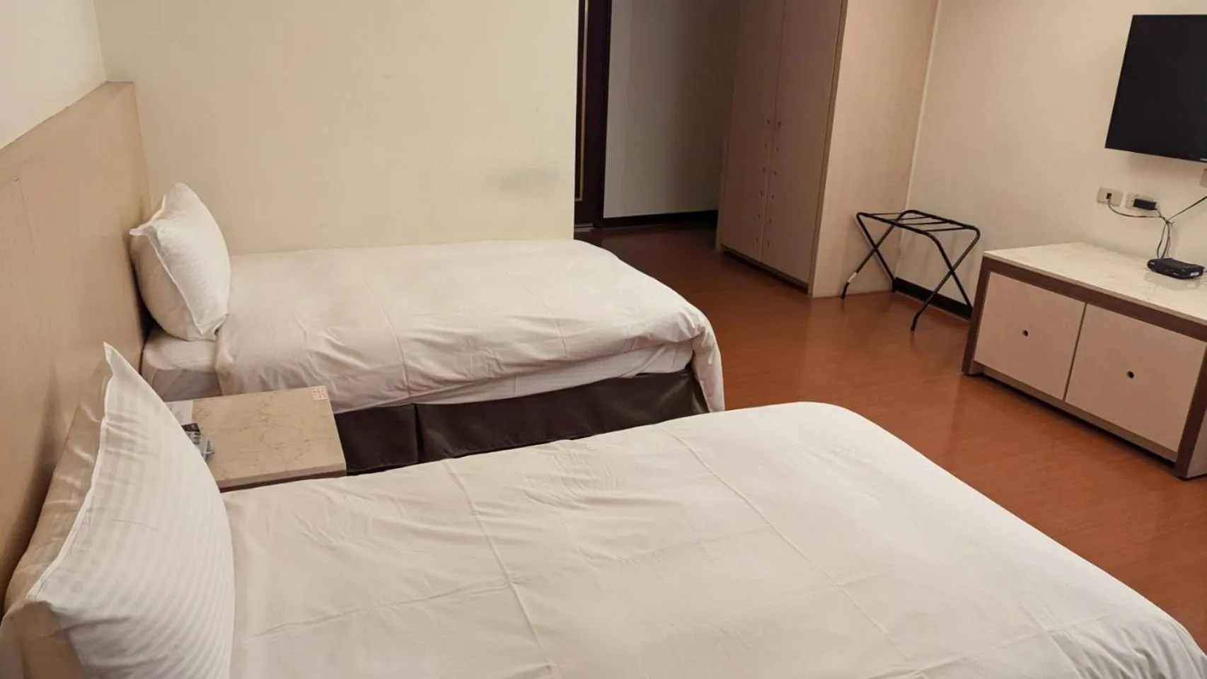 Bed in Waugh Den Business Hotel