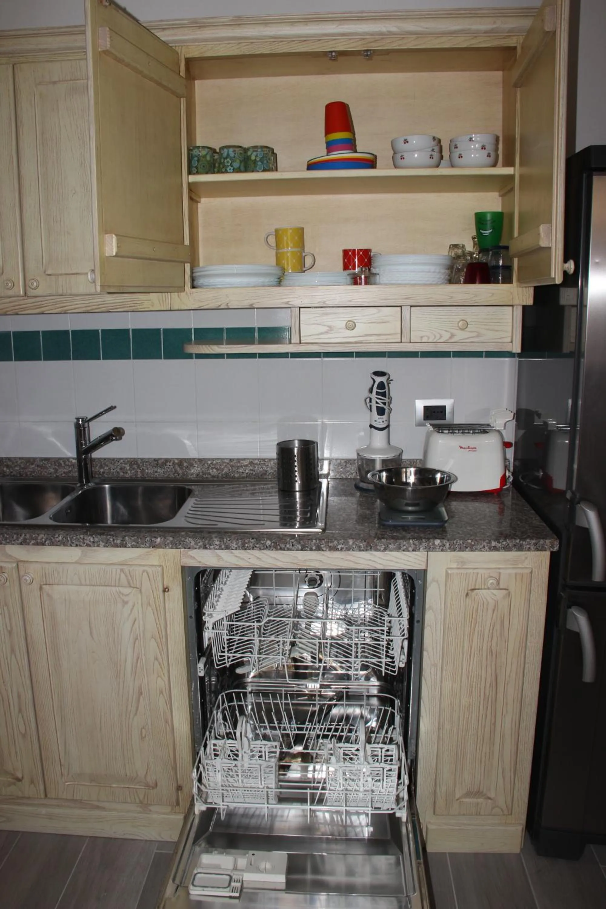 Kitchen or kitchenette in Appartamento Via dei Fabbri Navali