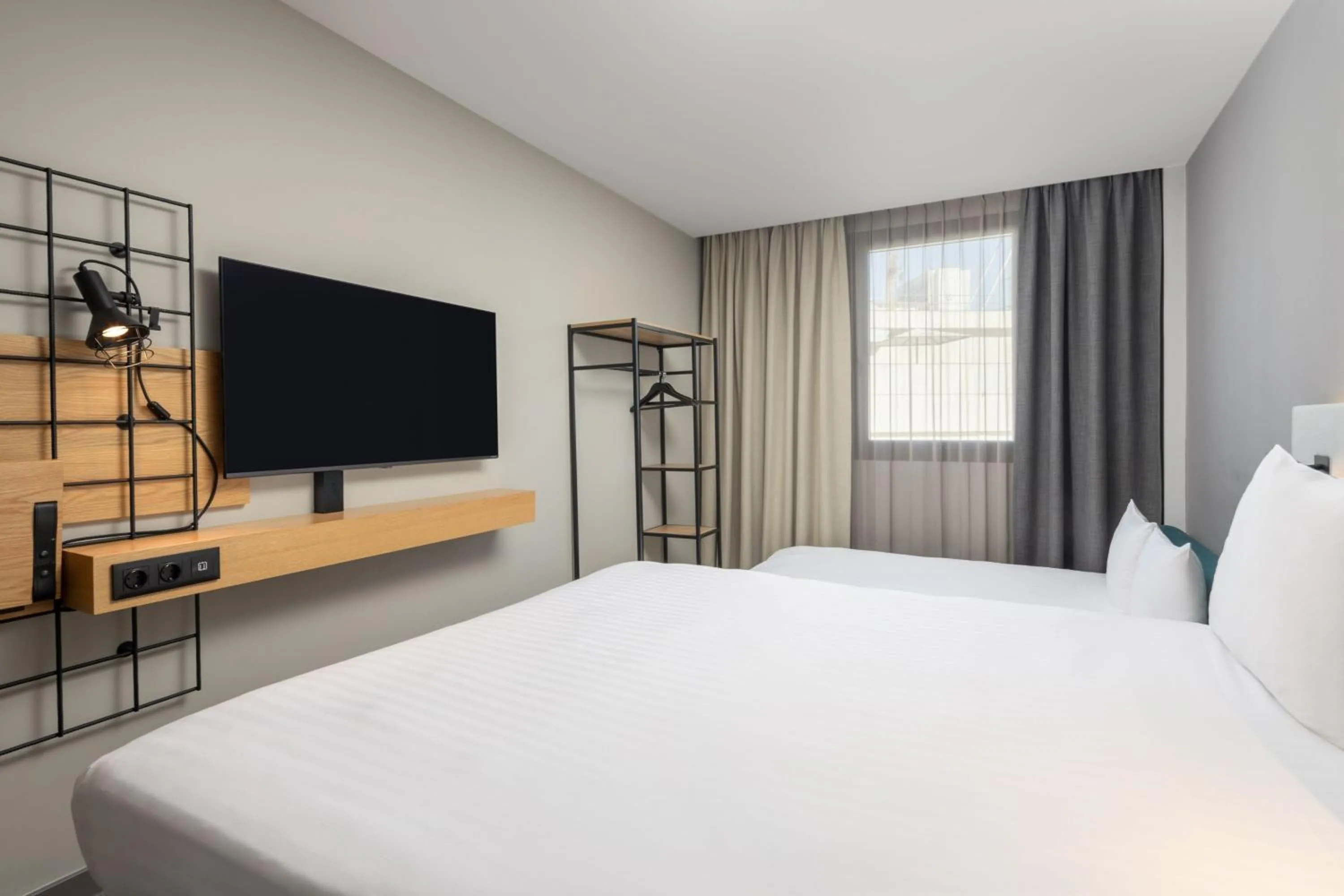 Photo of the whole room, Bed in Moxy Lisbon City