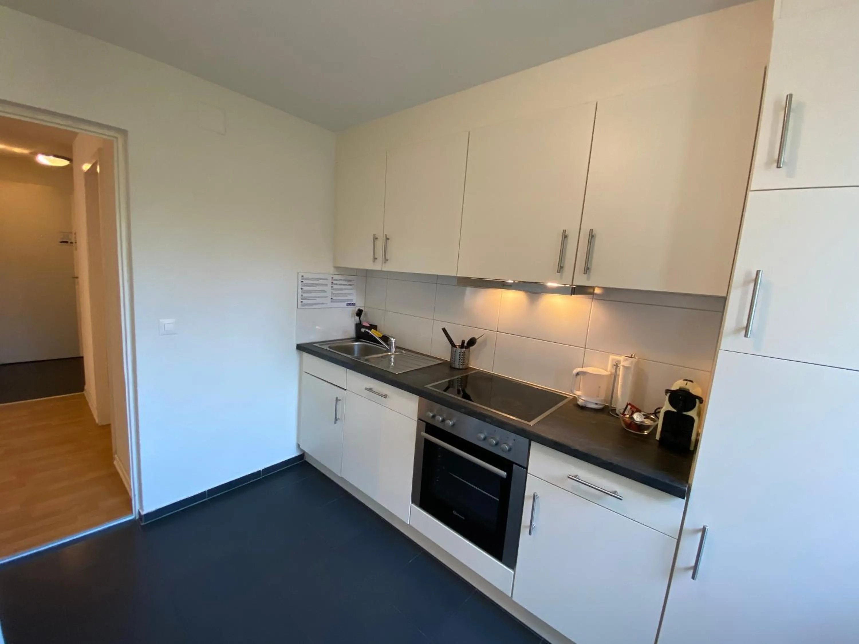 Kitchen or kitchenette in Galaxy Apartments Lucerne
