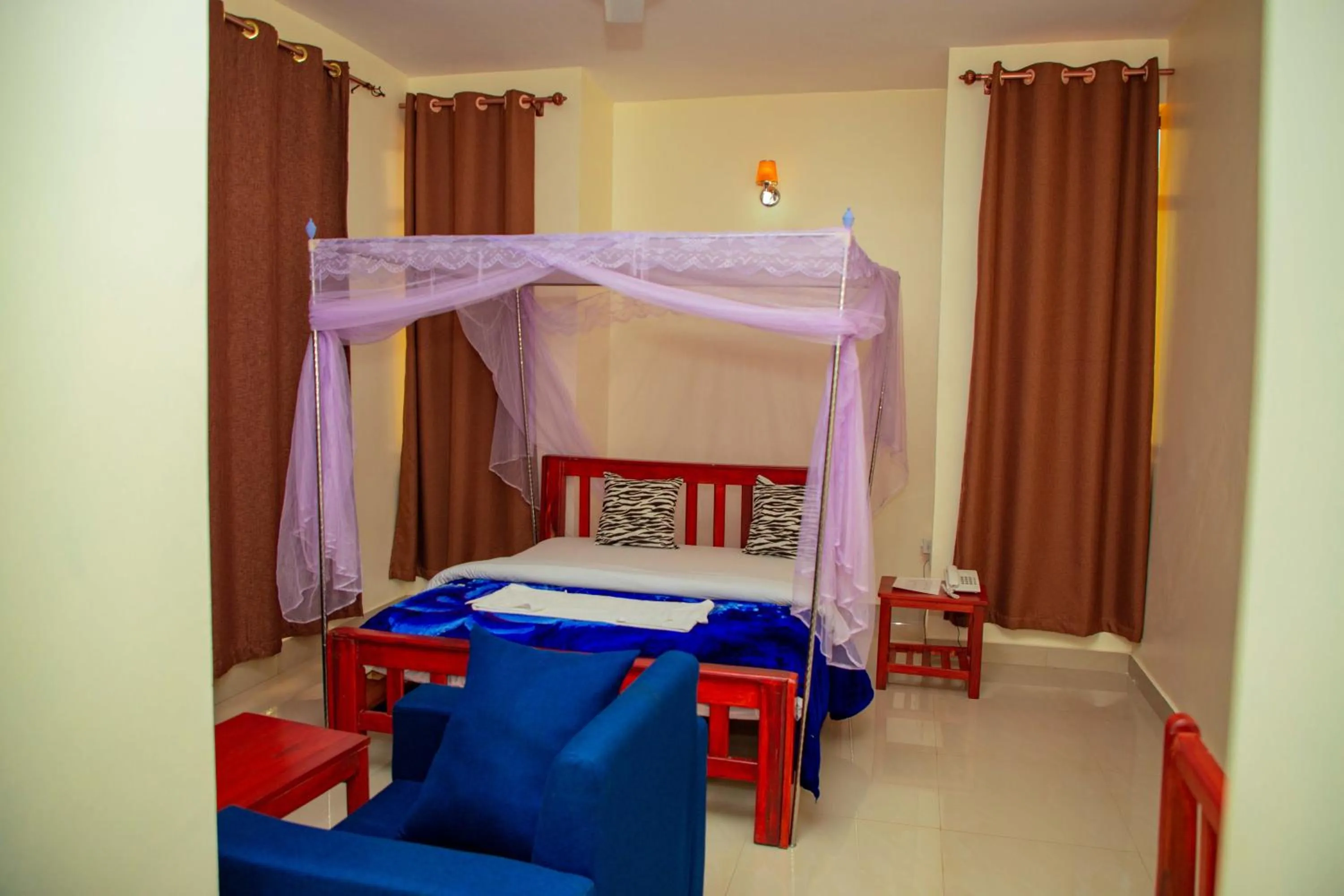 Bed in Kilimanjaro White House Hotel