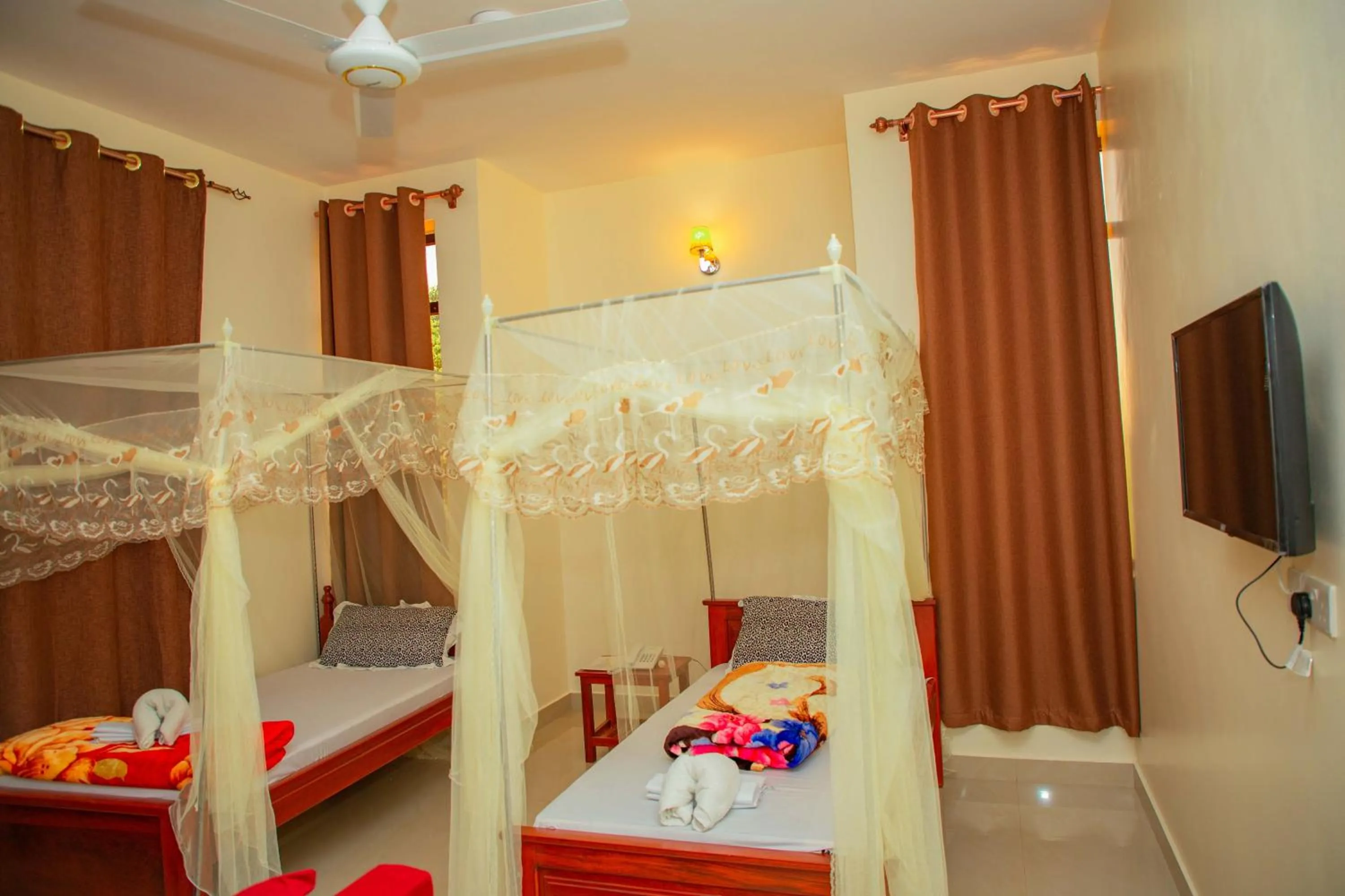 Bed in Kilimanjaro White House Hotel