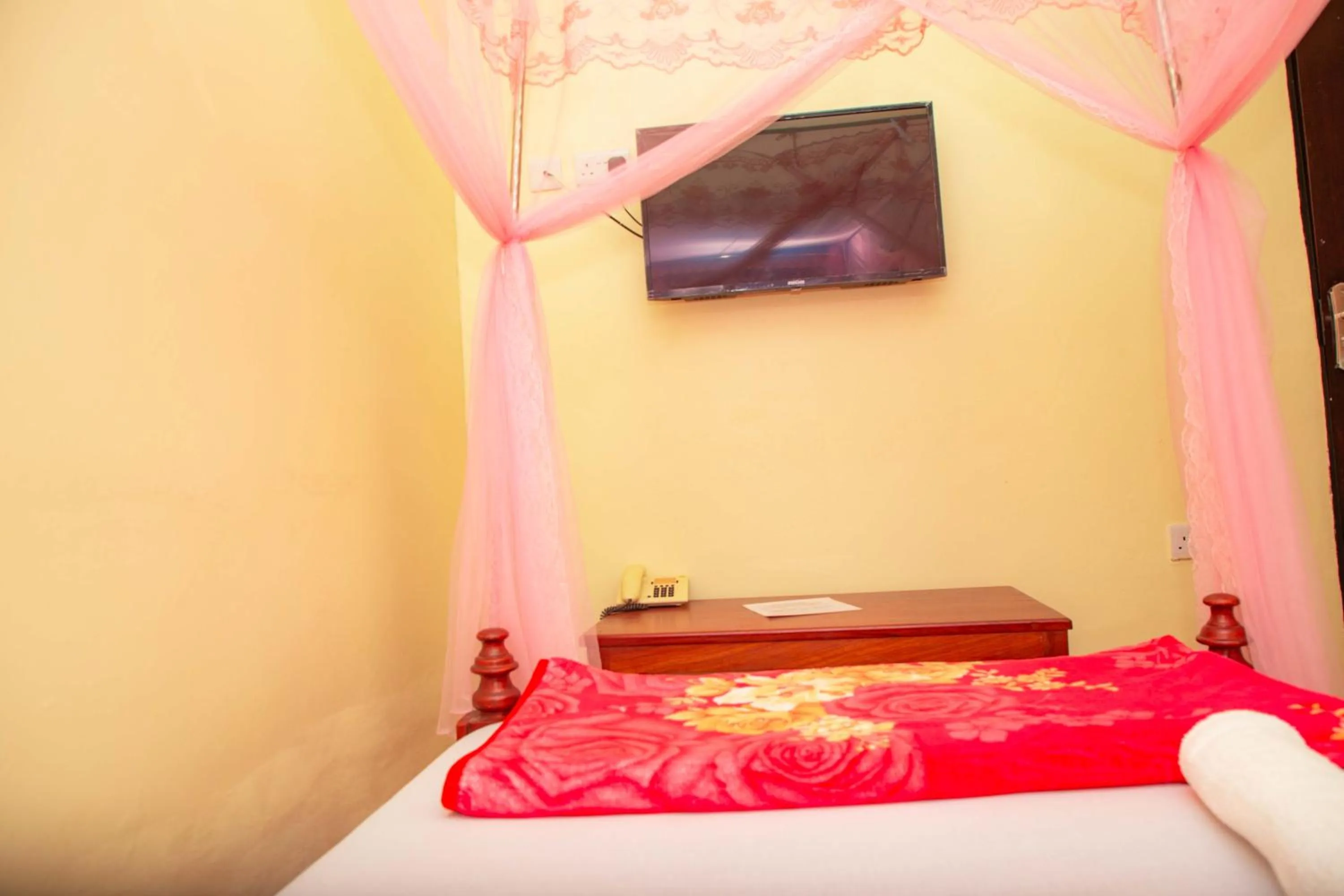 Bed in Kilimanjaro White House Hotel