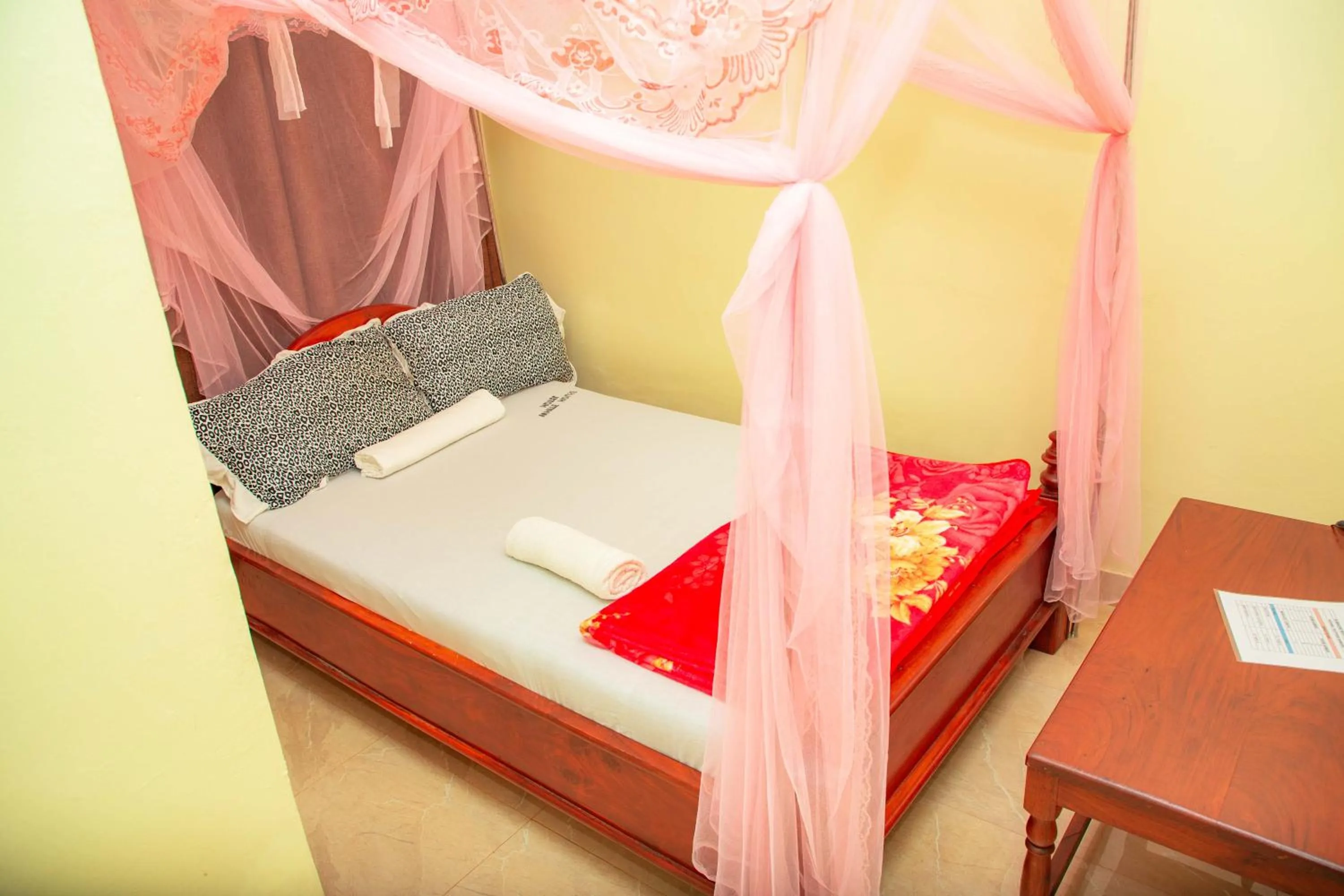 Bed in Kilimanjaro White House Hotel