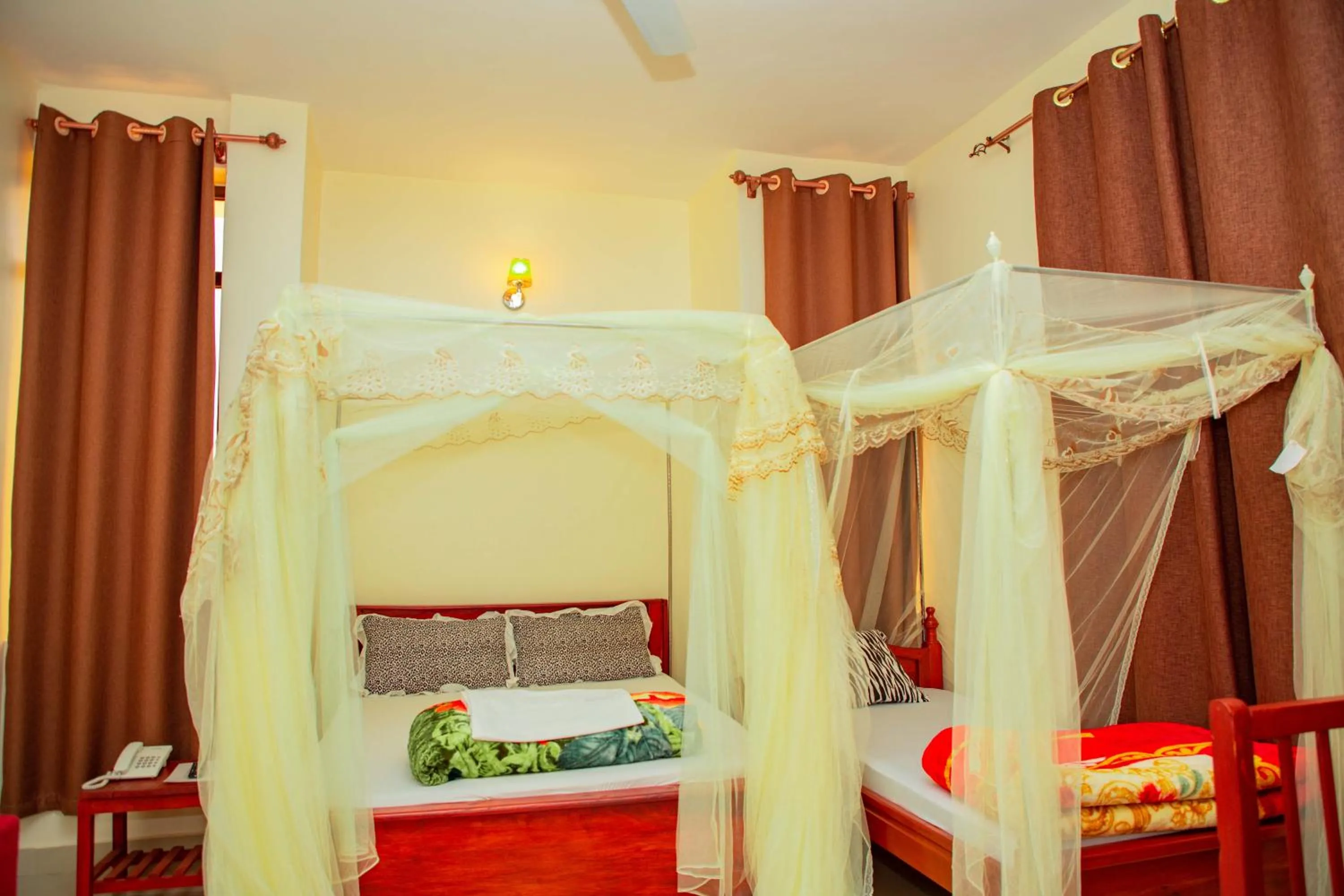 Bed in Kilimanjaro White House Hotel