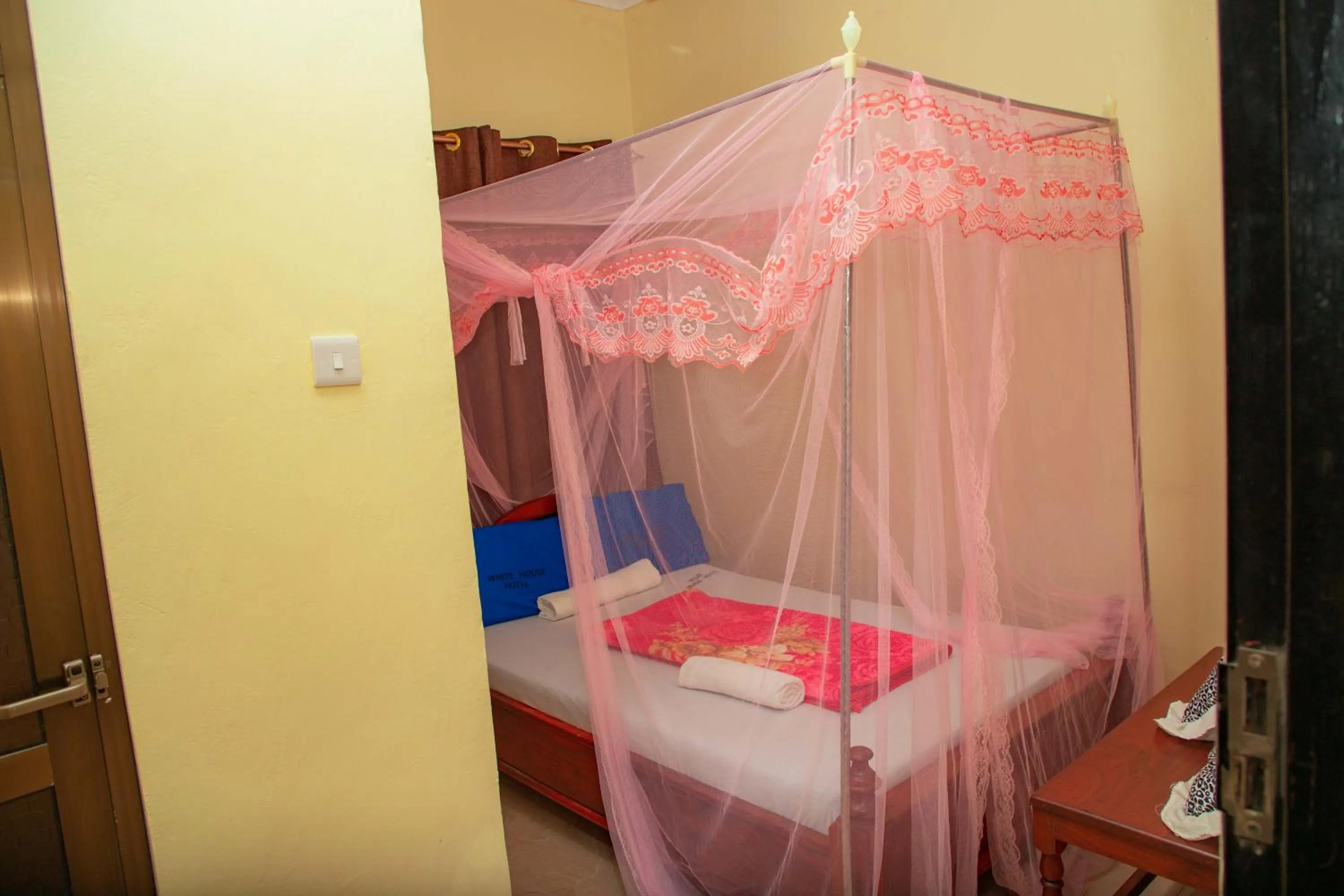 Bed in Kilimanjaro White House Hotel