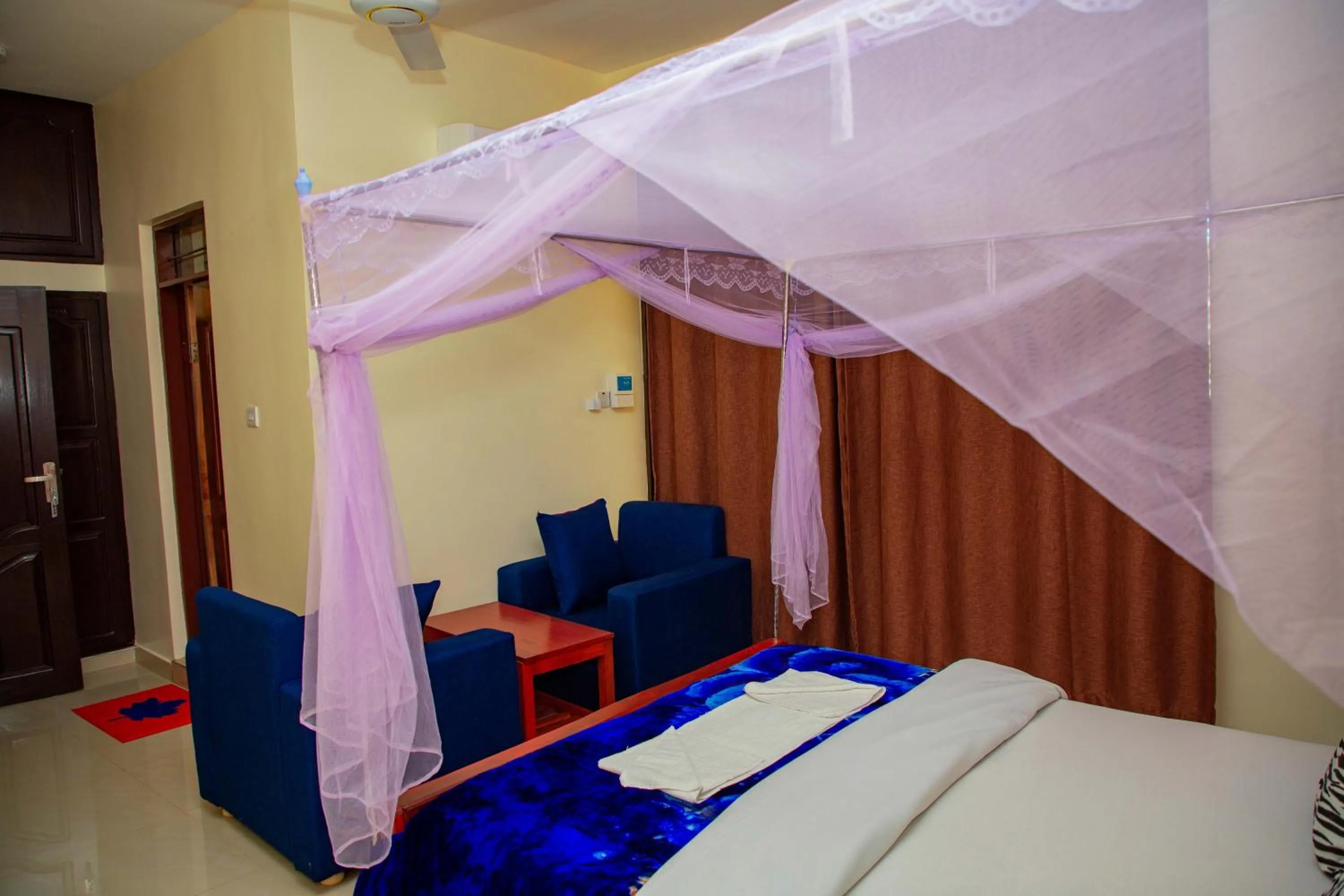 Bed in Kilimanjaro White House Hotel