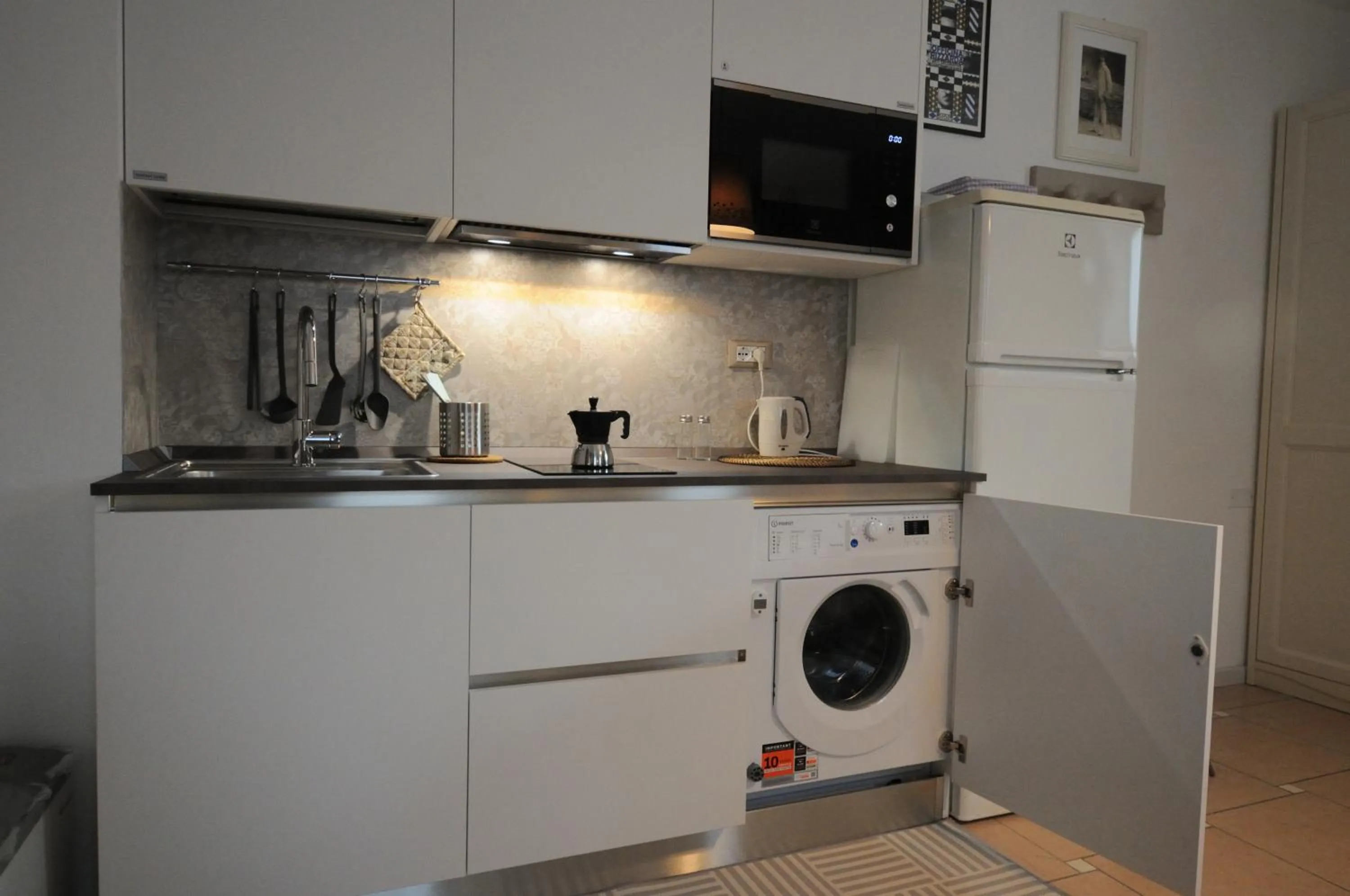 Kitchen or kitchenette in Casa Novecento "Rooms & apartments"