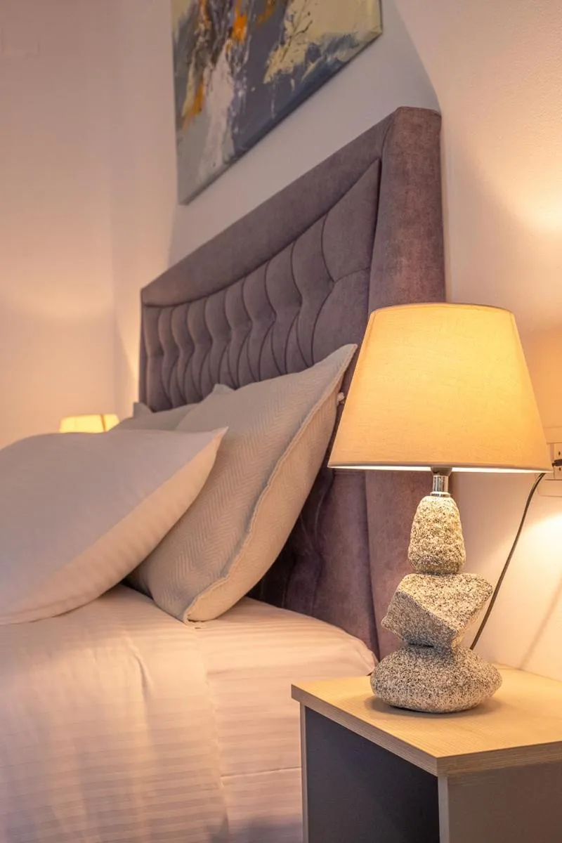 Bed in Serenity Luxe Suites