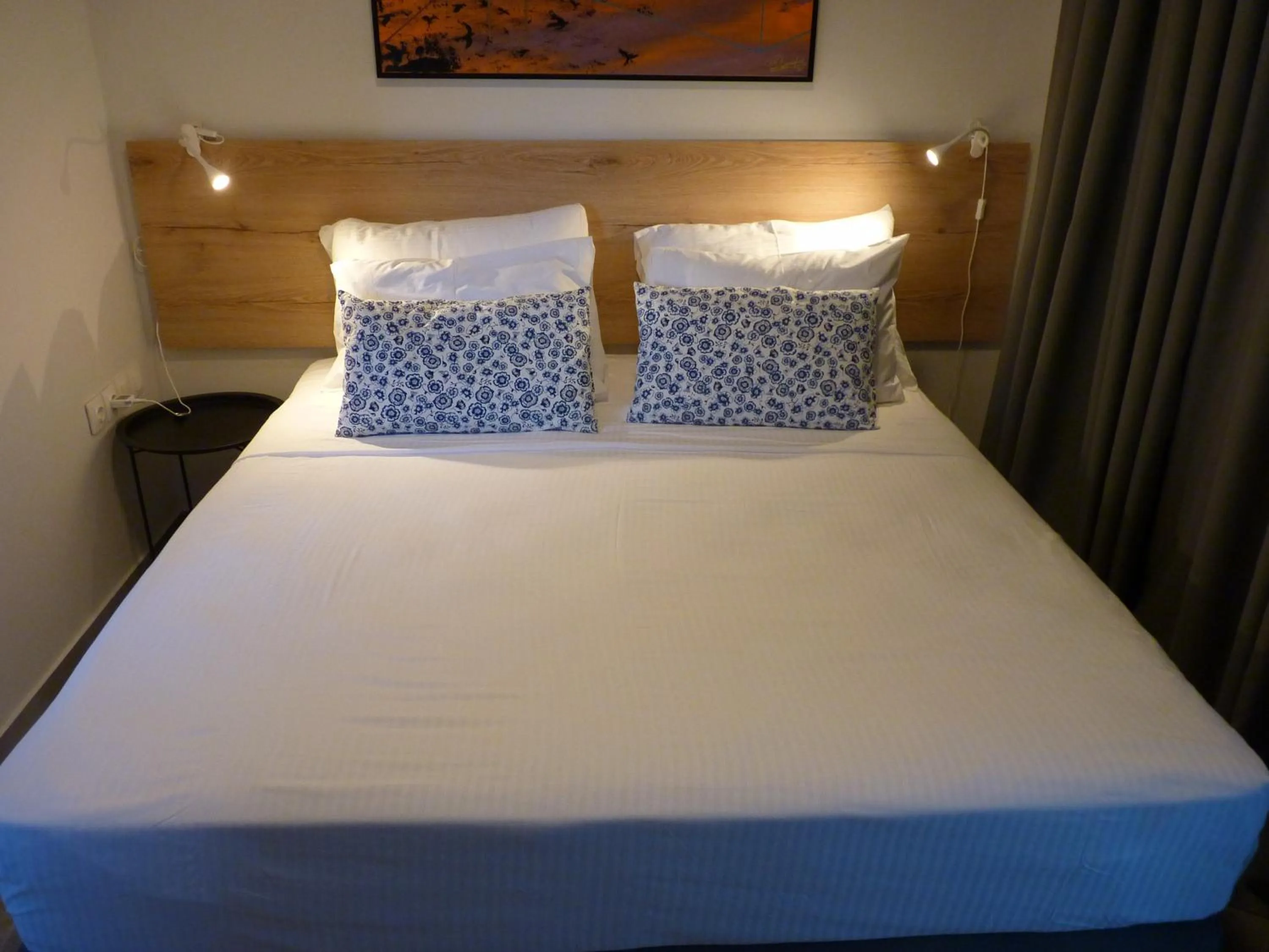 Bed in Comfort Suites & Rooms