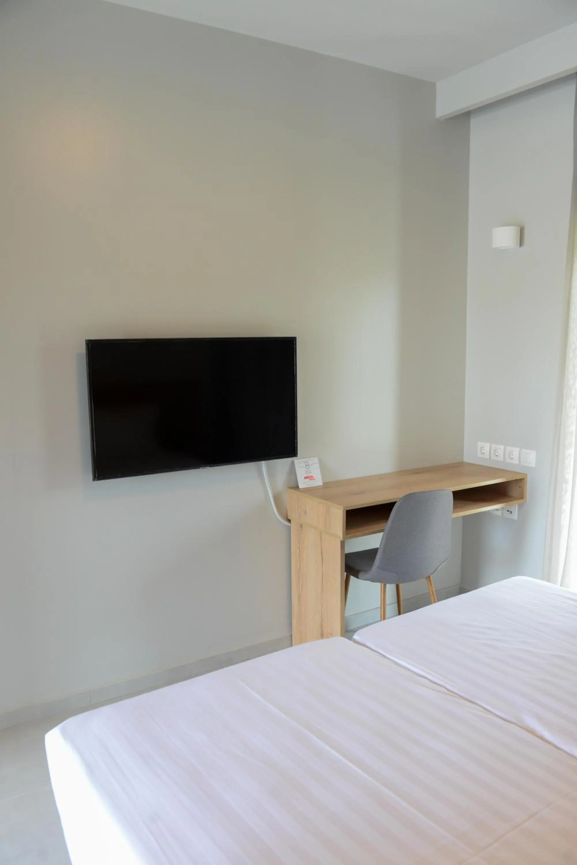 Bed in Comfort Suites & Rooms