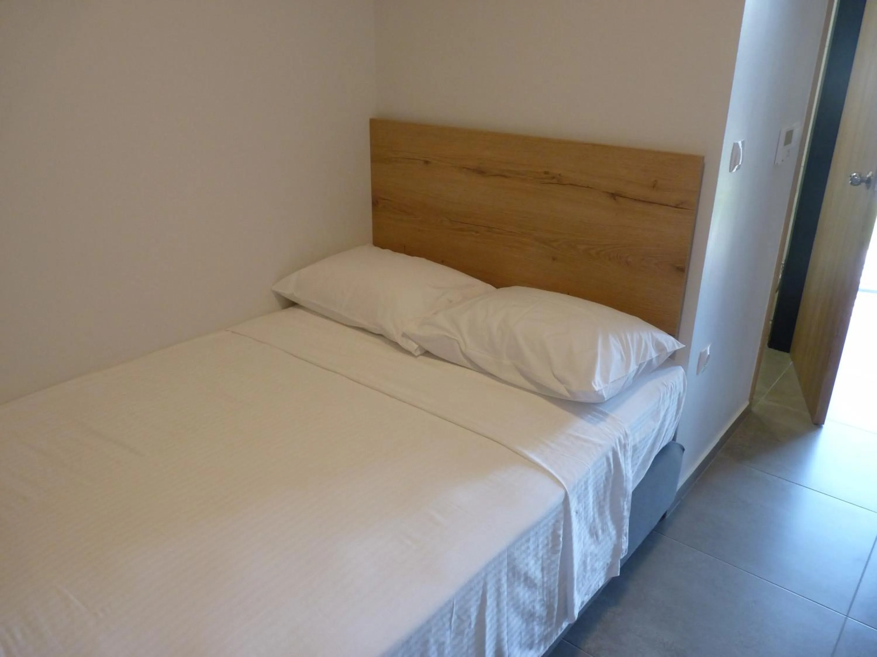 Bed in Comfort Suites & Rooms