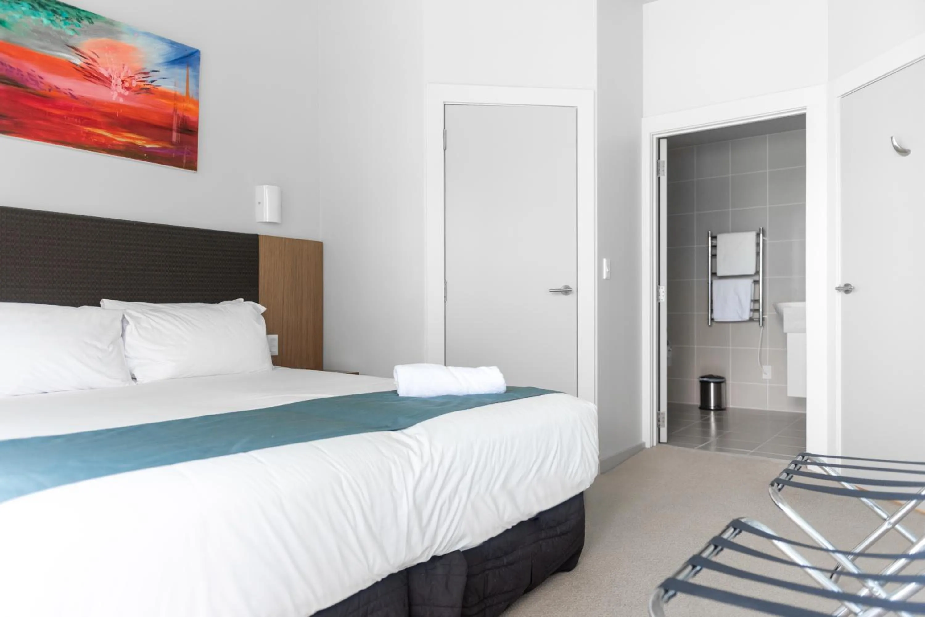 Bathroom, Bed in Ocean Breeze Hotel