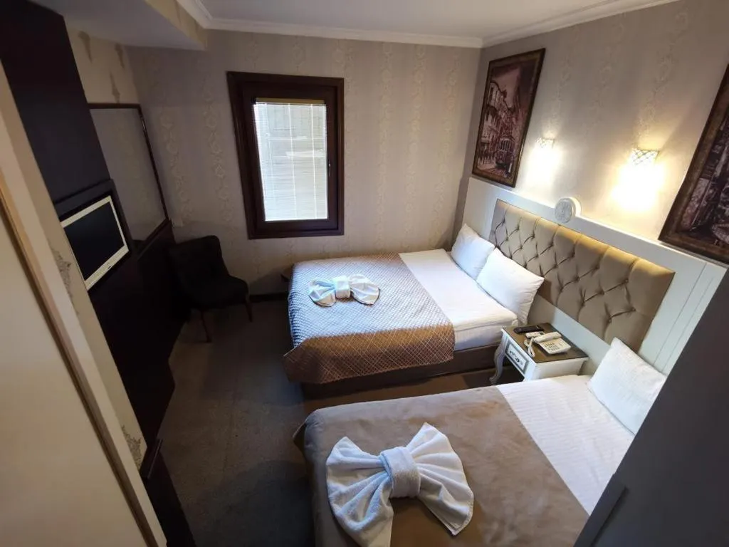 Bed in Taksim Cuento Hotel