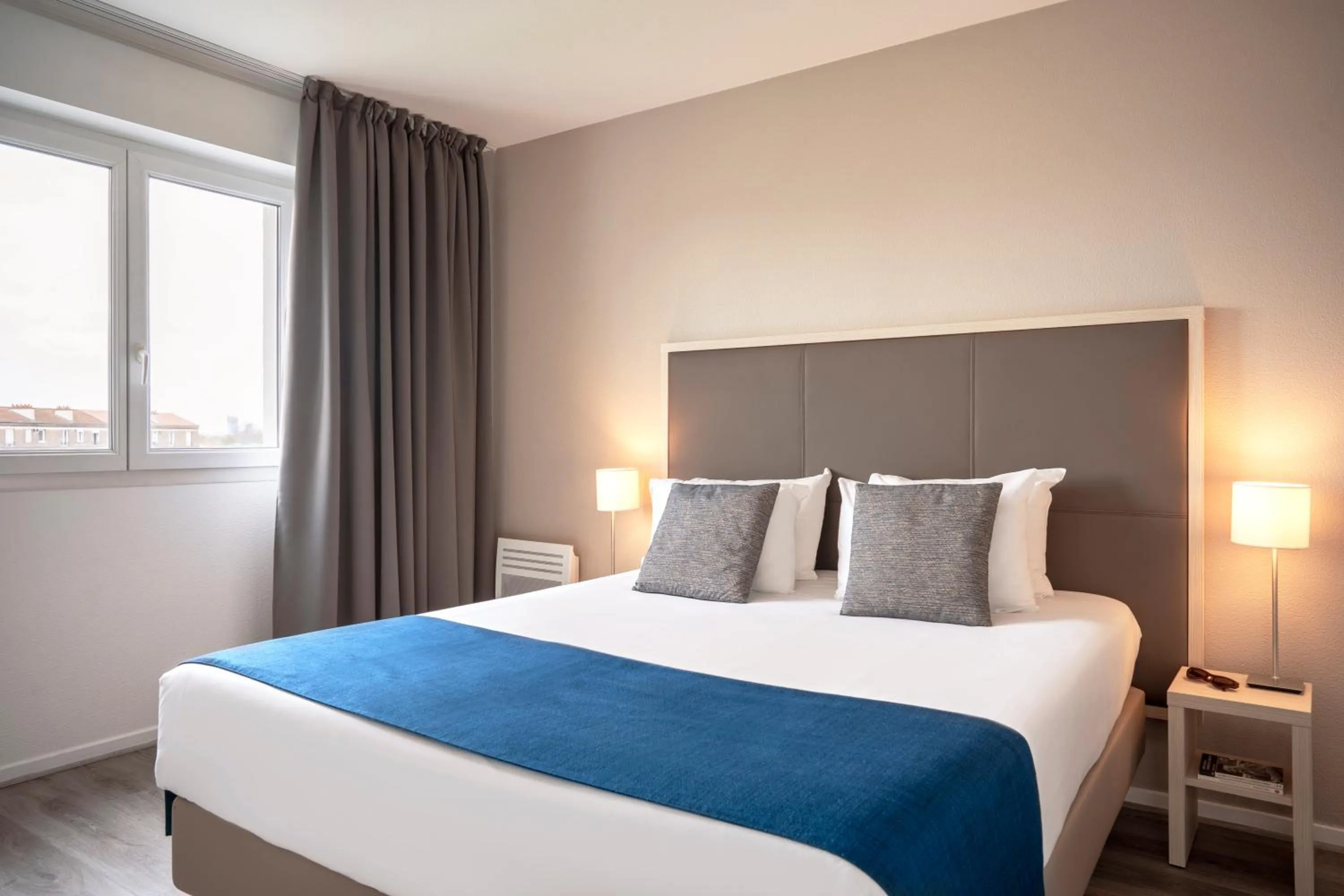 Bed in Séjours & Affaires Paris Vincennes