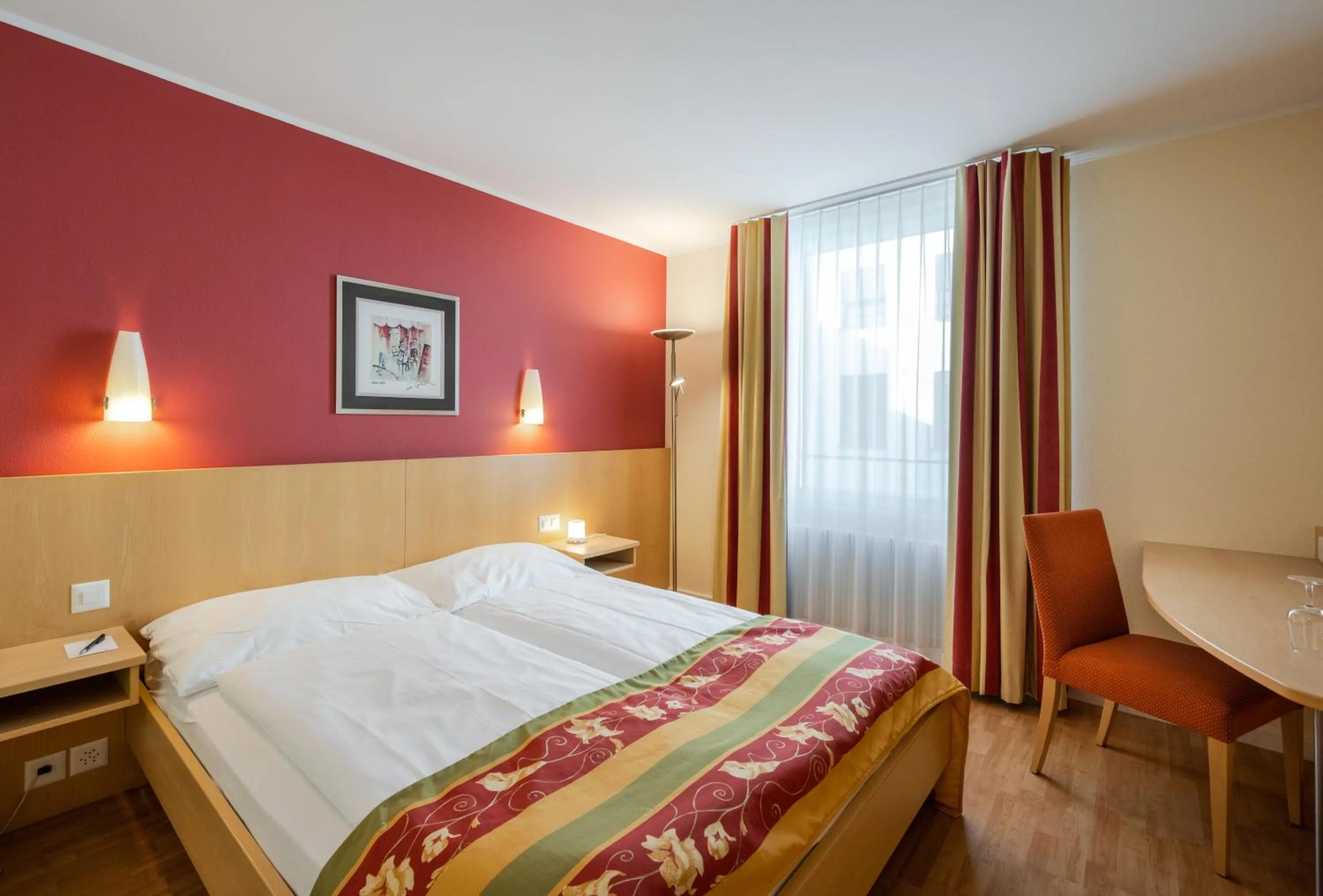 Bed in Ambassador Self Check-in Hotel