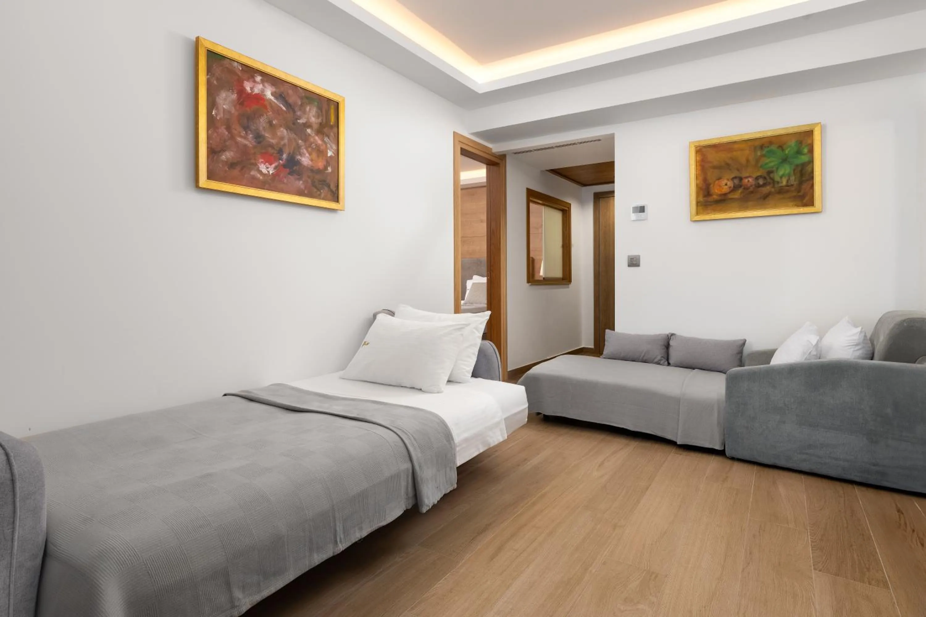 Living room, Bed in Acandia Hotel