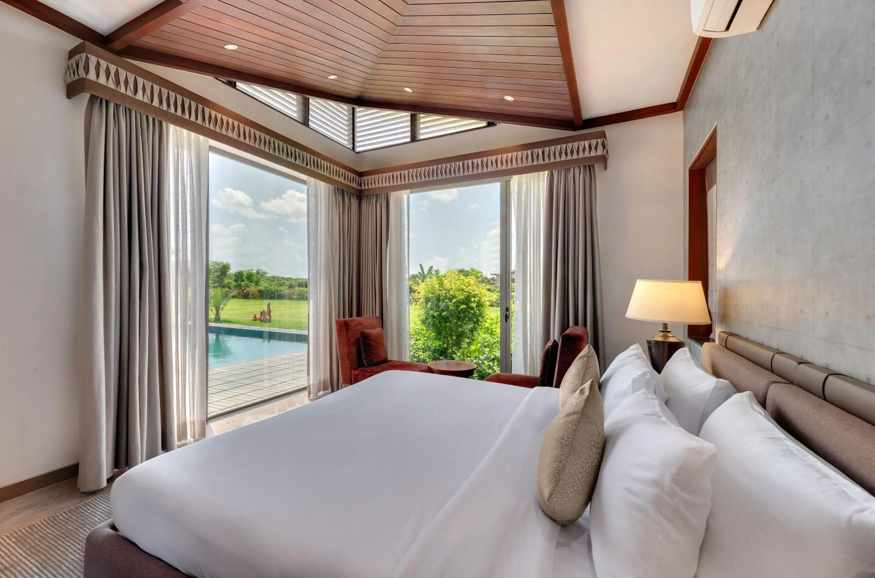 Bed in The Fern Royal Farm Resort, Anjar