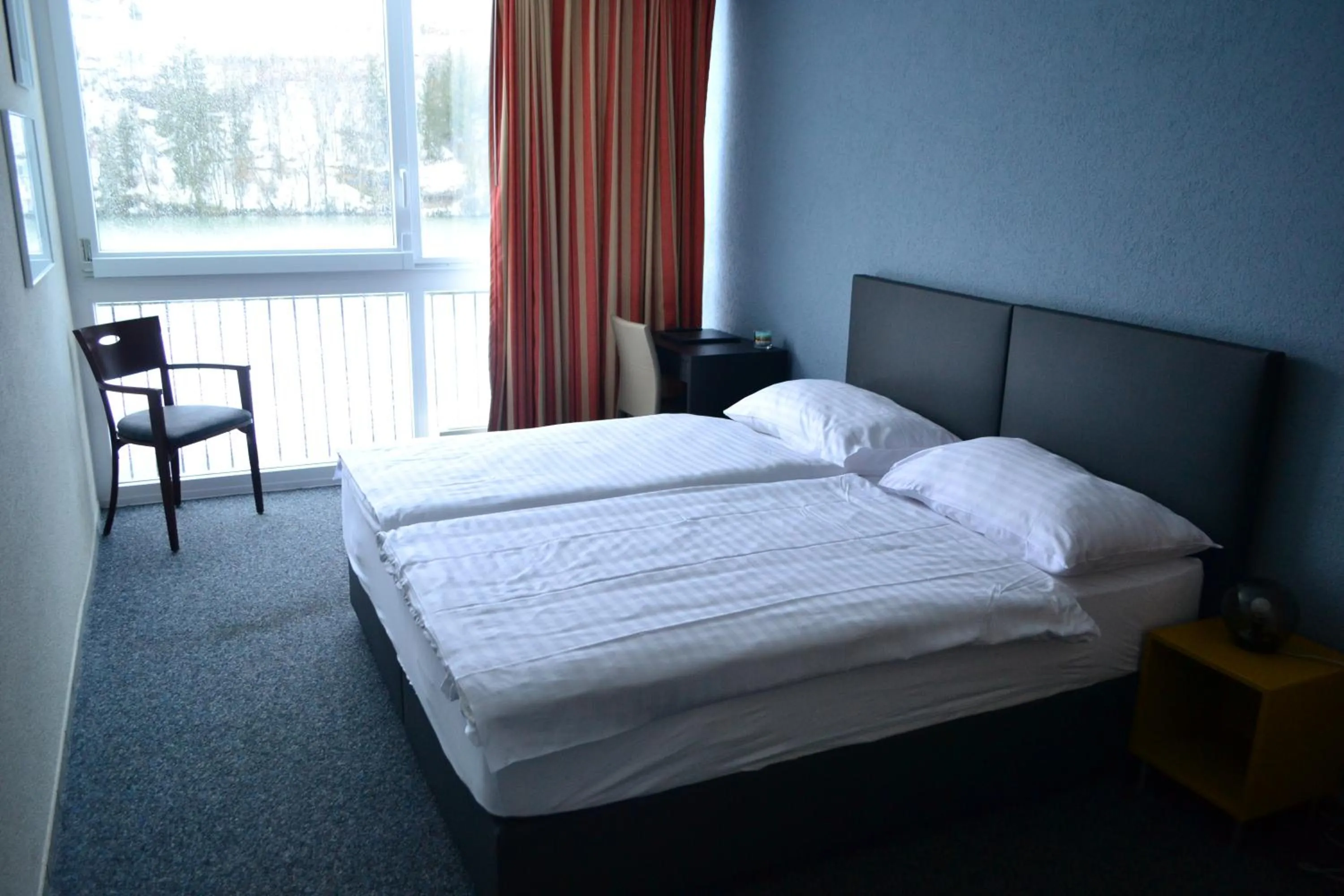 Bed in Hotel Les Rives Du Doubs