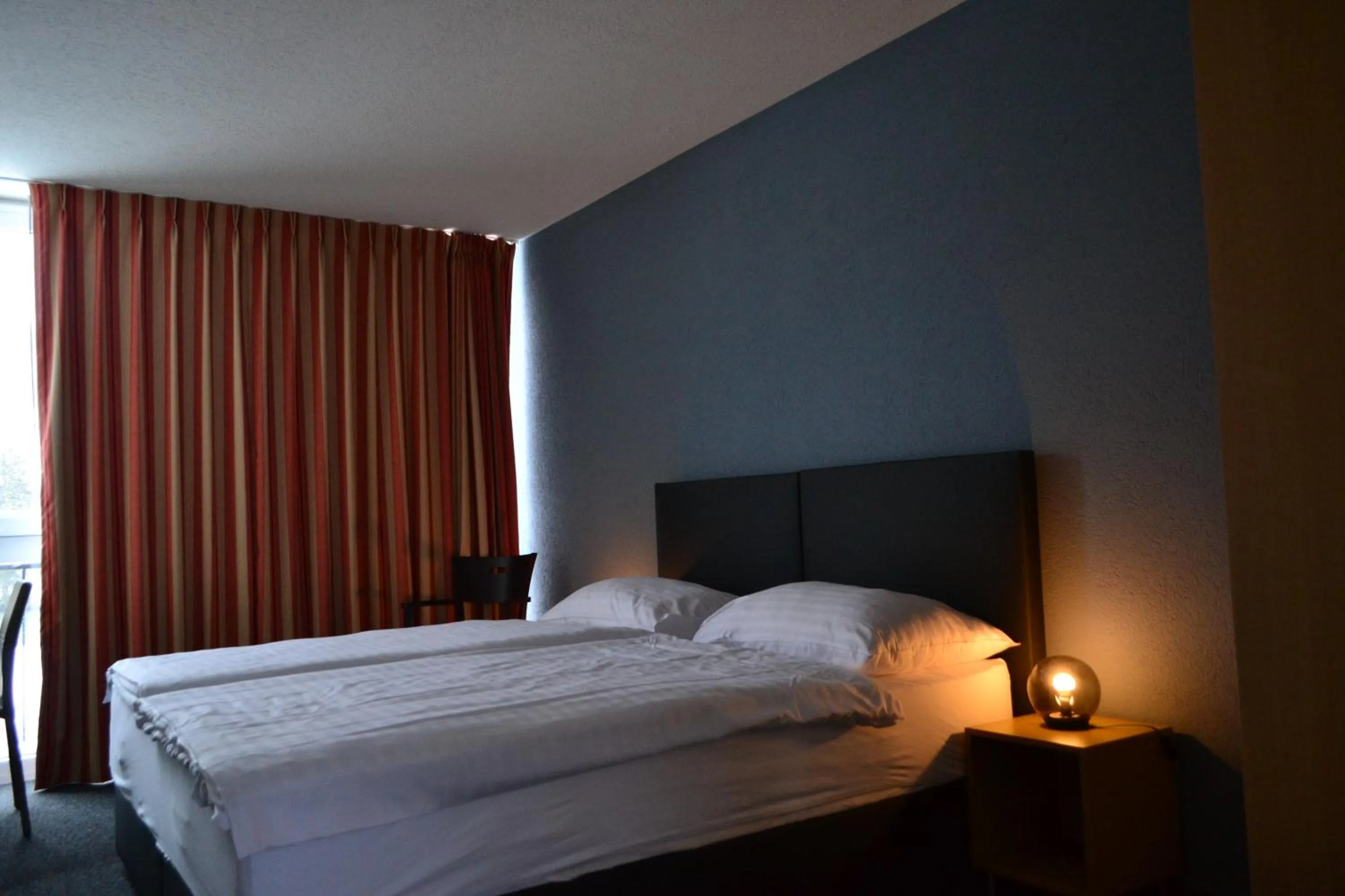 Bed in Hotel Les Rives Du Doubs