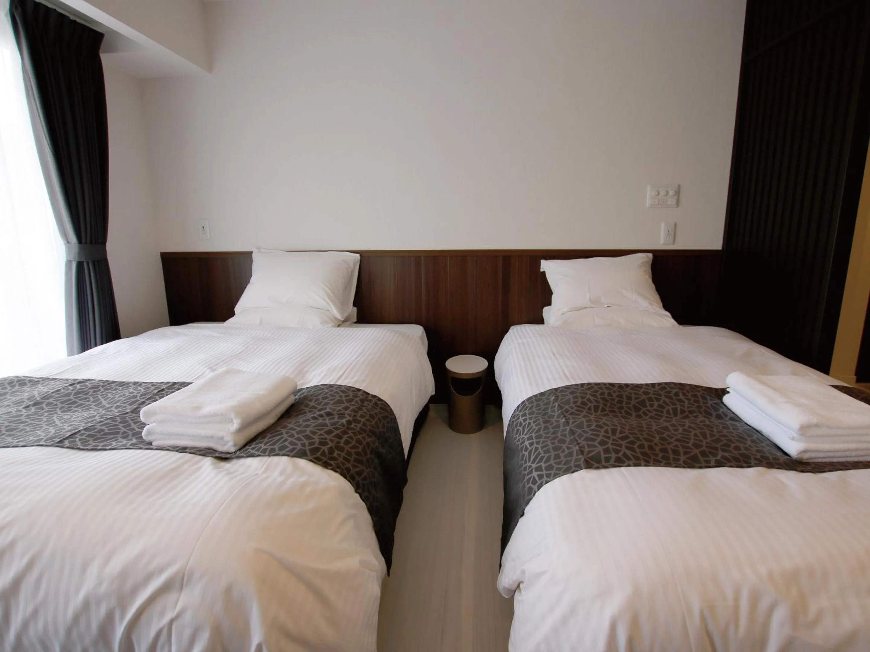 Bed in Sunset Resort Mihama -SEVEN Hotels and Resorts-