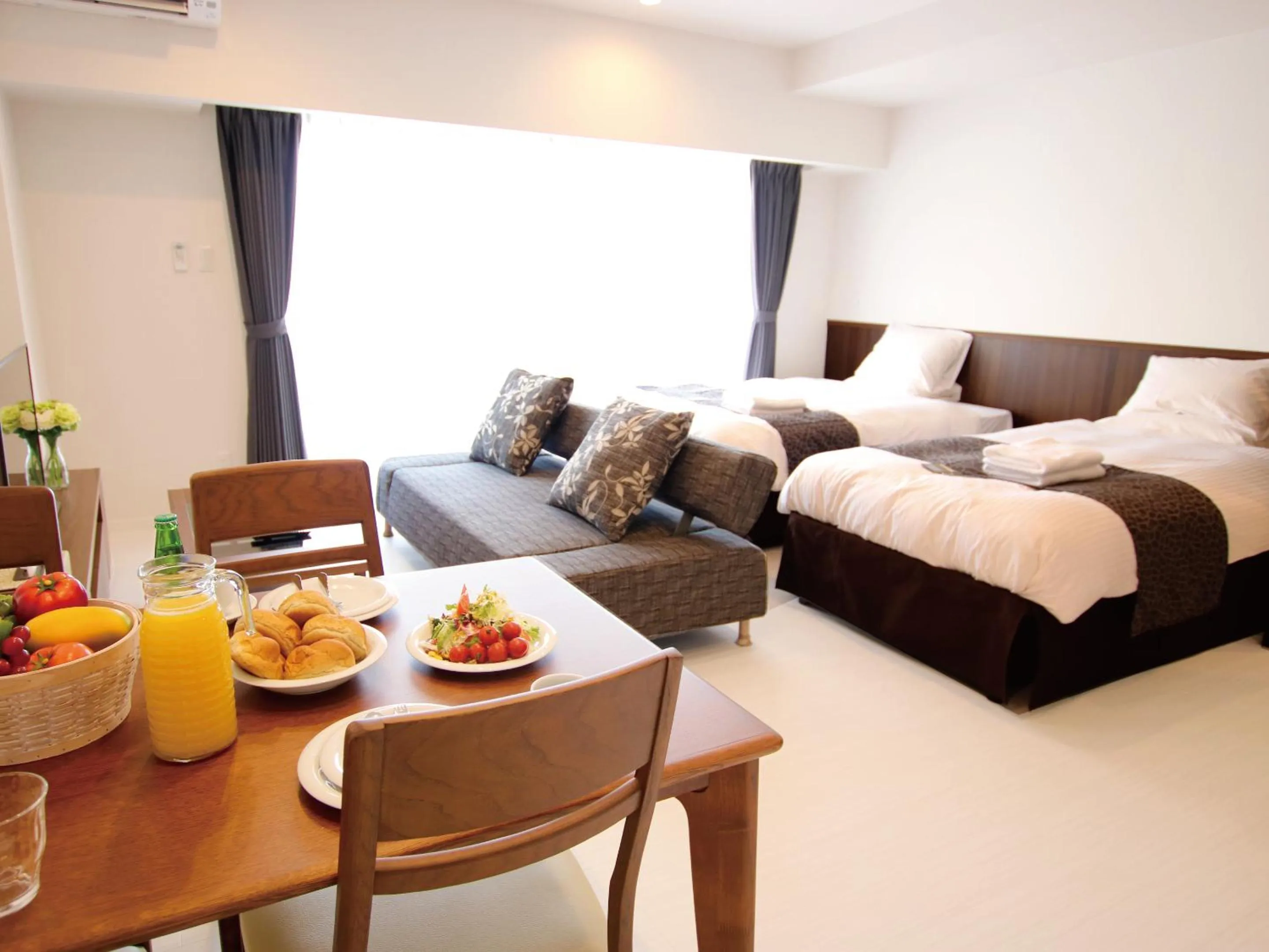 Living room, Bed in Sunset Resort Mihama -SEVEN Hotels and Resorts-