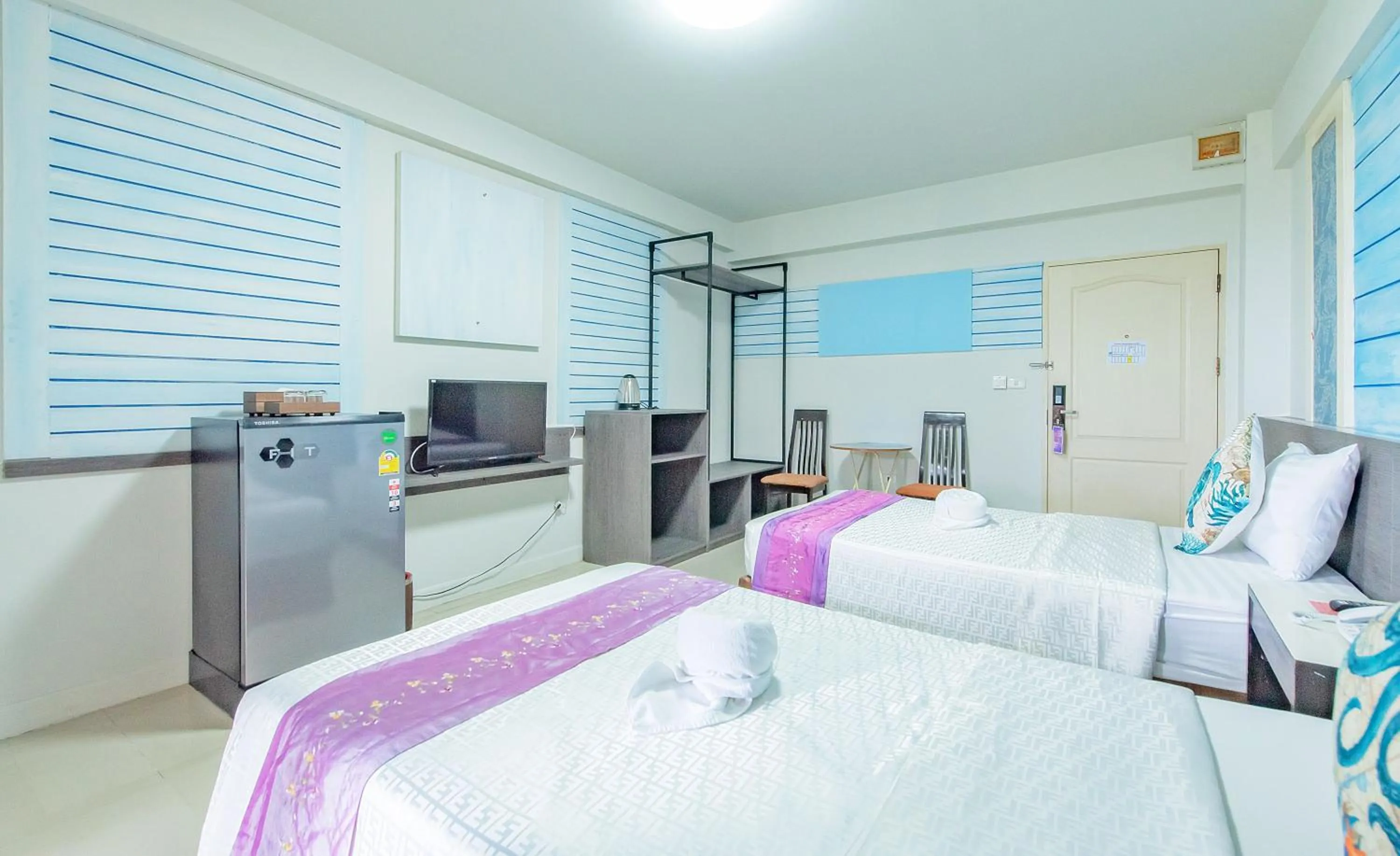 Bed in The Wing Design Hotel