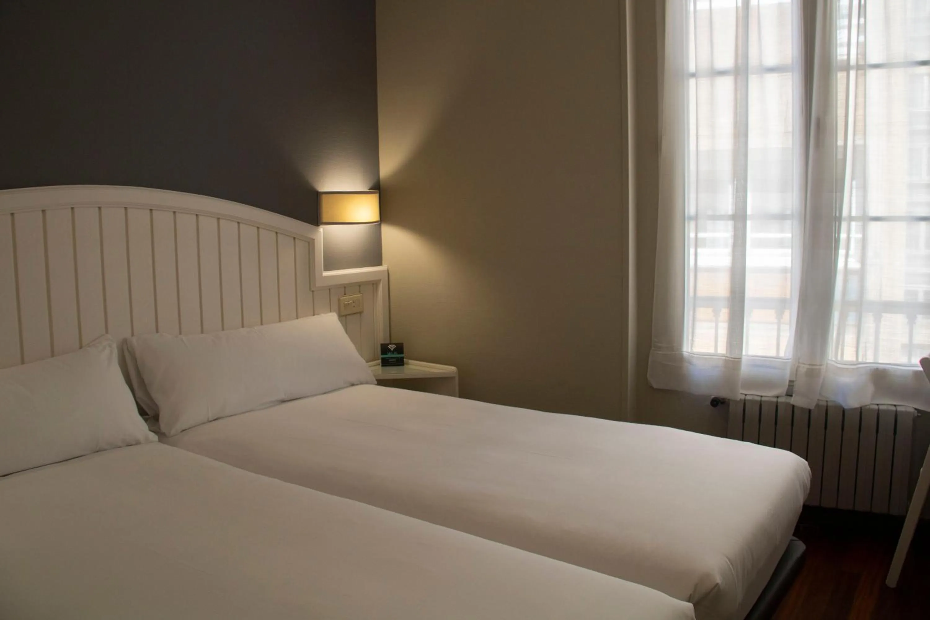 Bed in Alda Miramar Rooms