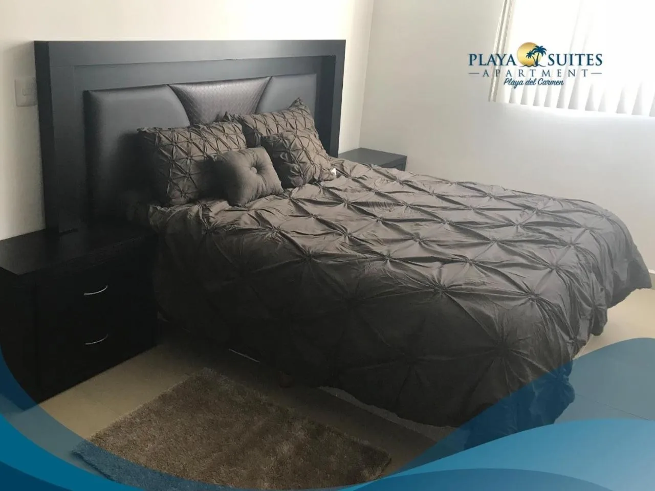 Bed in PLAYA SUITES apartment