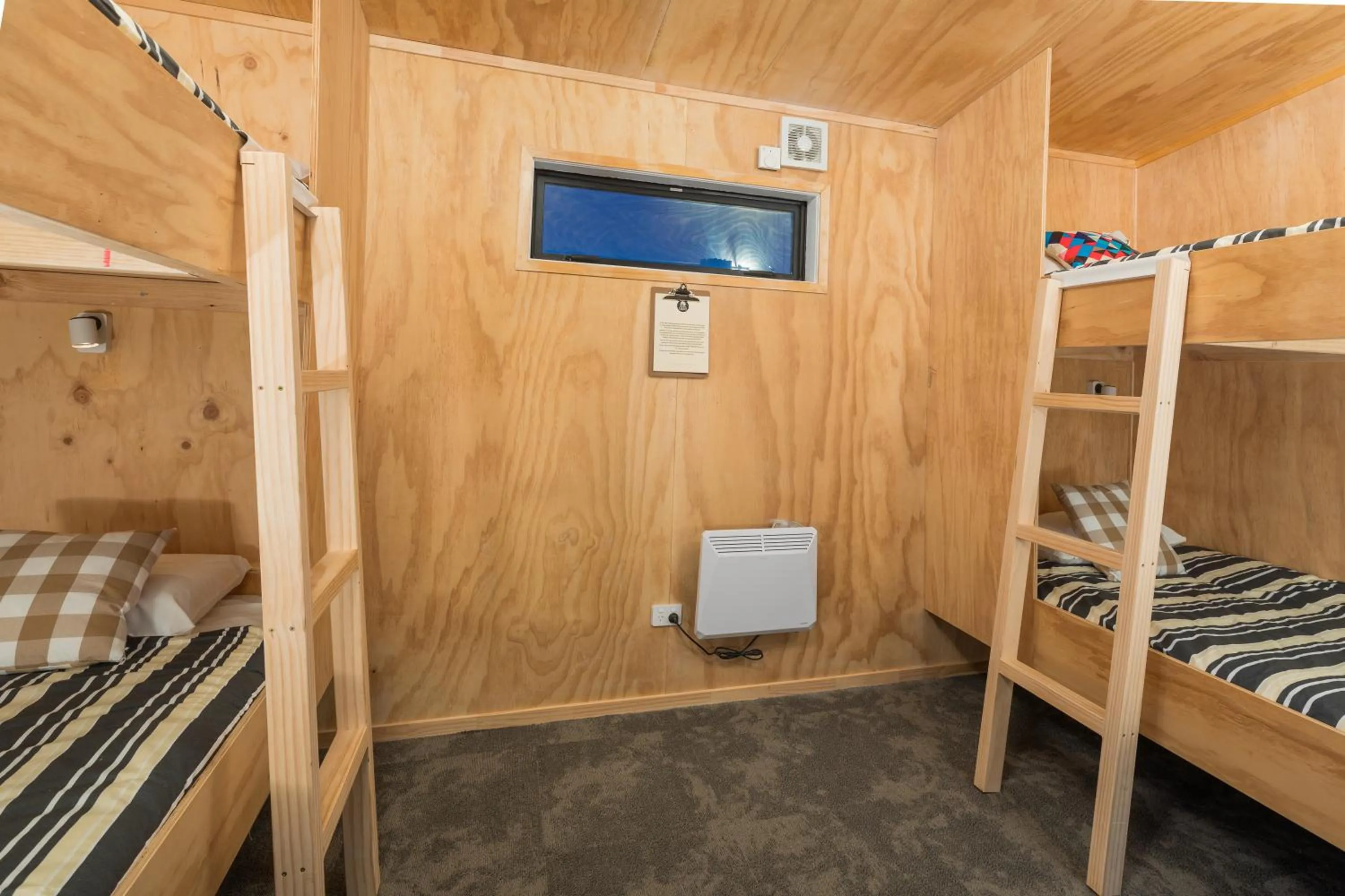 Bed in Waitomo Homestead Cabins